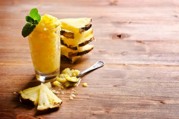 Pineapple sorbet presented in a clear glass