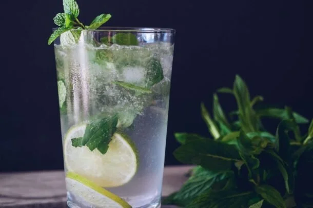 Refreshing lime and mint soda in a glass
