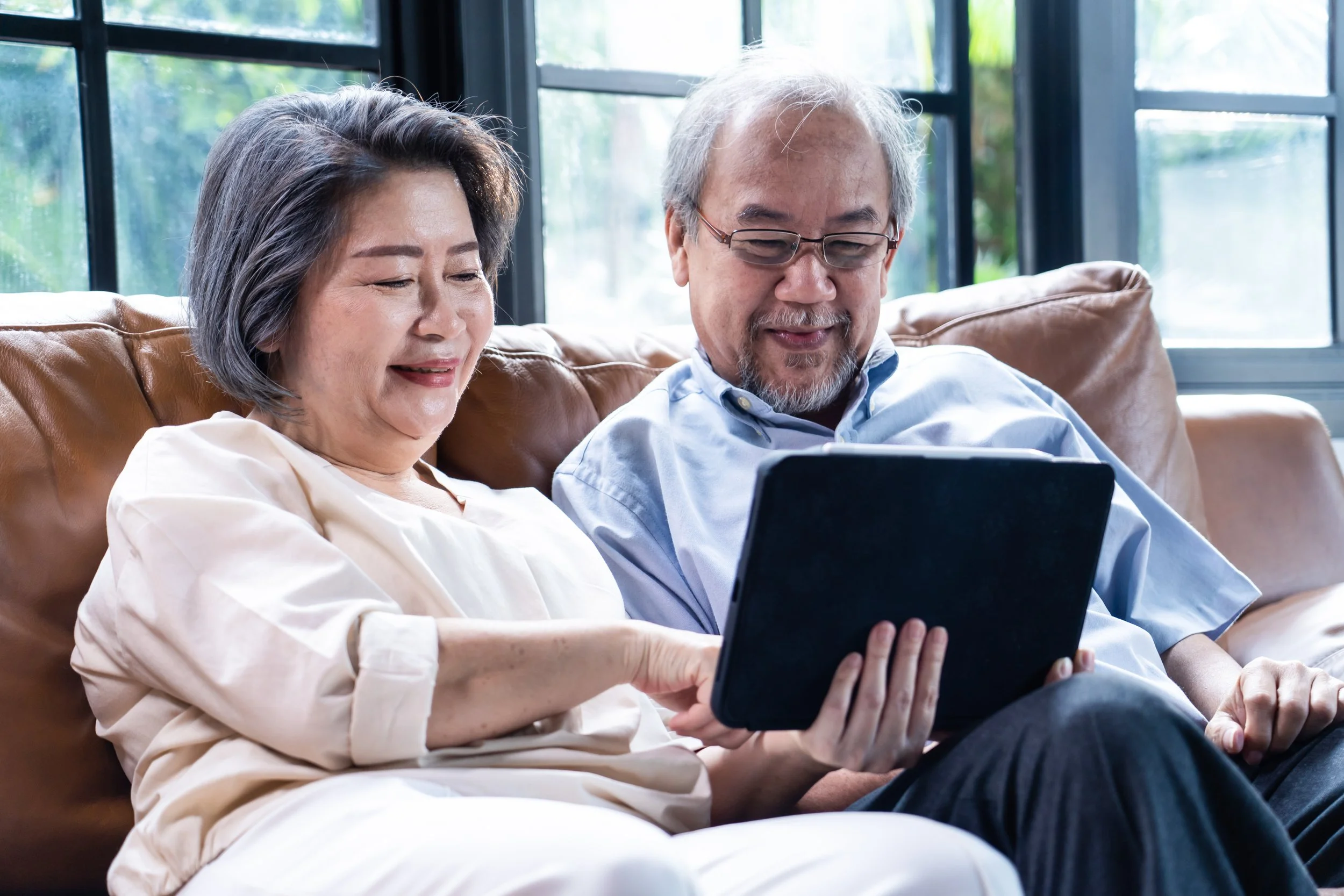 Two adults looking at a screen