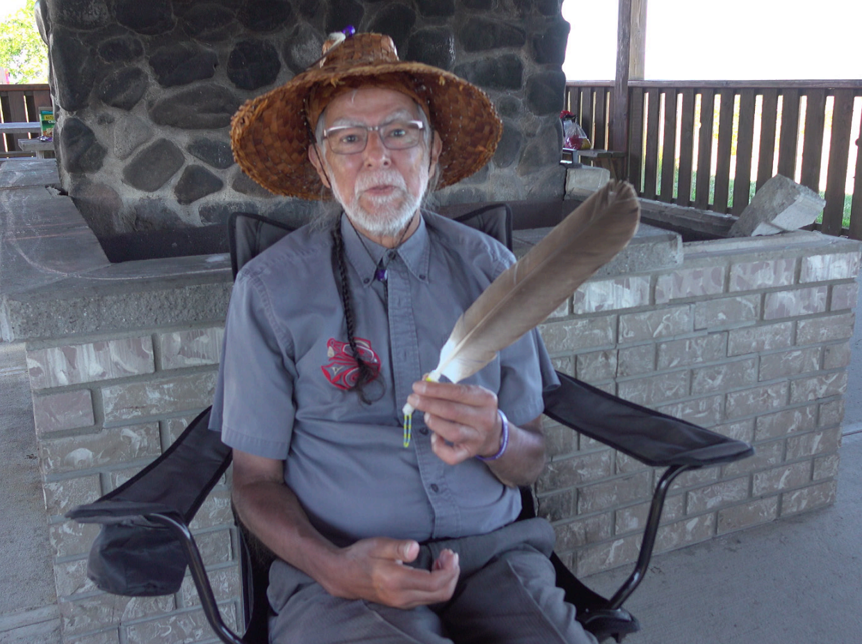 Chief Michael Recalma holding a feather