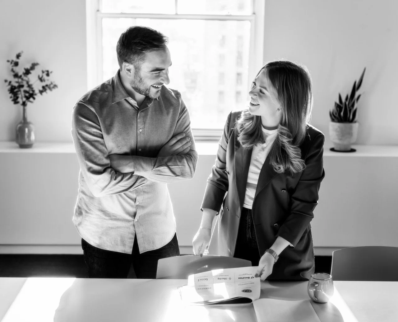 O’Leary Group principal and project lead reviewing a construction project presentation together.