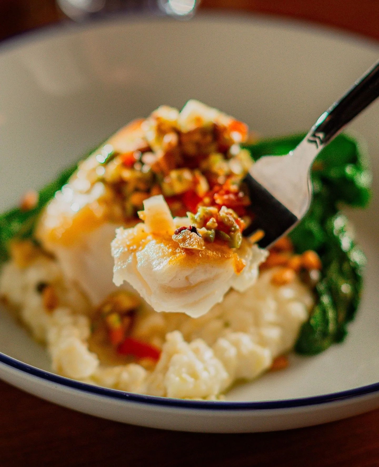 Chef Mike&rsquo;s Fish &amp; Grits is the perfect comfort food for a chilly day. Pan seared catch of the day with smoked feta &amp; lemon grits, and saut&eacute;d kale, topped with a warm olive vinaigrette and toasted pine nuts. 😋🐟️⁠

📸: @drewmayn