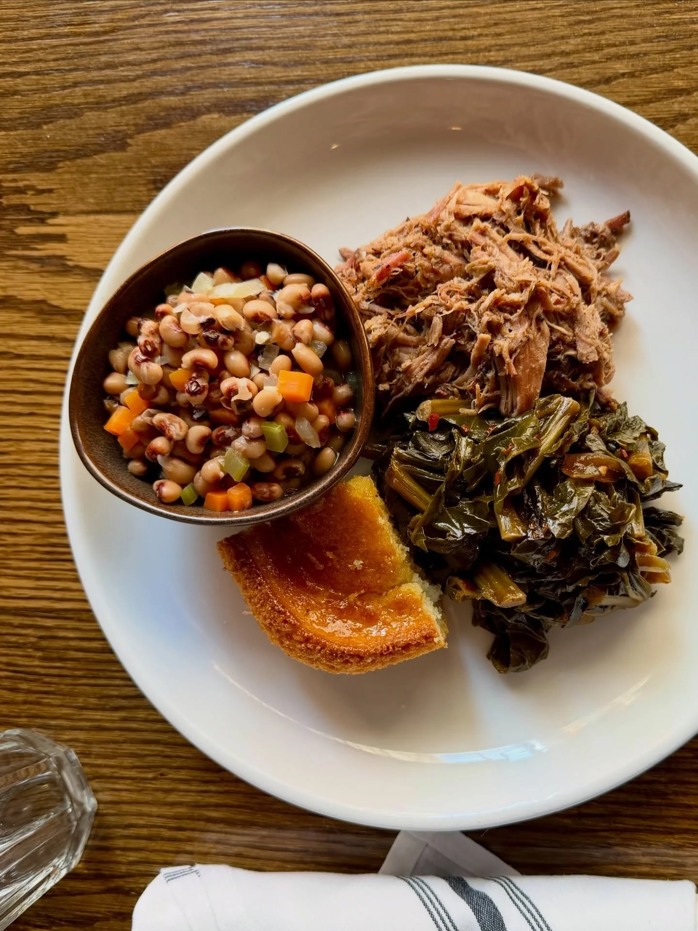 This traditional Southern New Year&rsquo;s meal will bring you good fortune in 2026! Featuring black-eyed peas for luck, collard greens for prosperity, hot pulled pork for progress, and honey butter cornbread for gold.⁠ Today only at Saffire!

And if