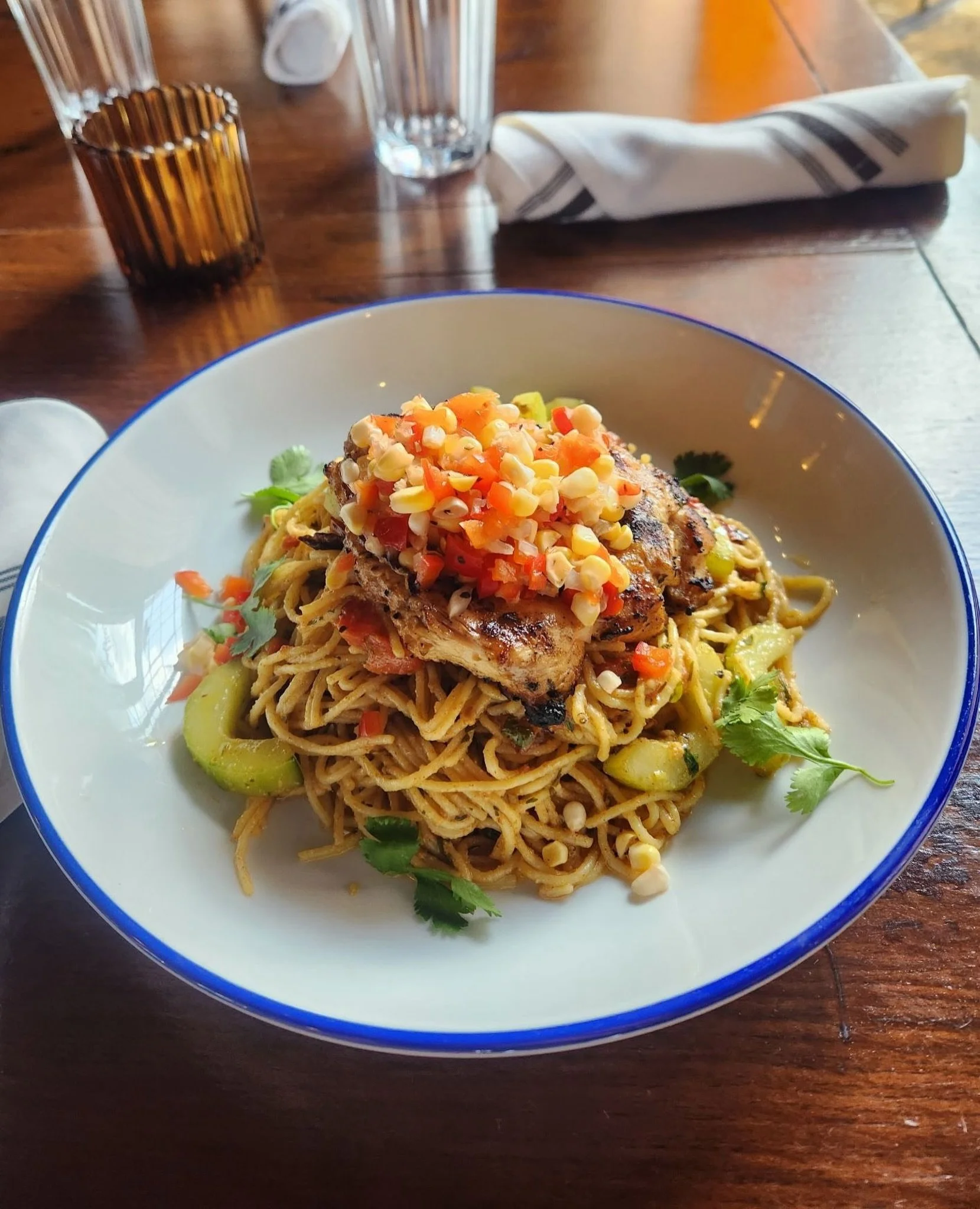 The Rio Grande Pasta is almost too beautiful to eat... almost!⁠
⁠
Made with hickory grilled lime and coriander chicken, spaghettini, cucumber, roasted tomato, corn, and red pepper relish. 😋⁠
⁠
⁠
#franklintn #factoryatfranklin #hickorygrilled