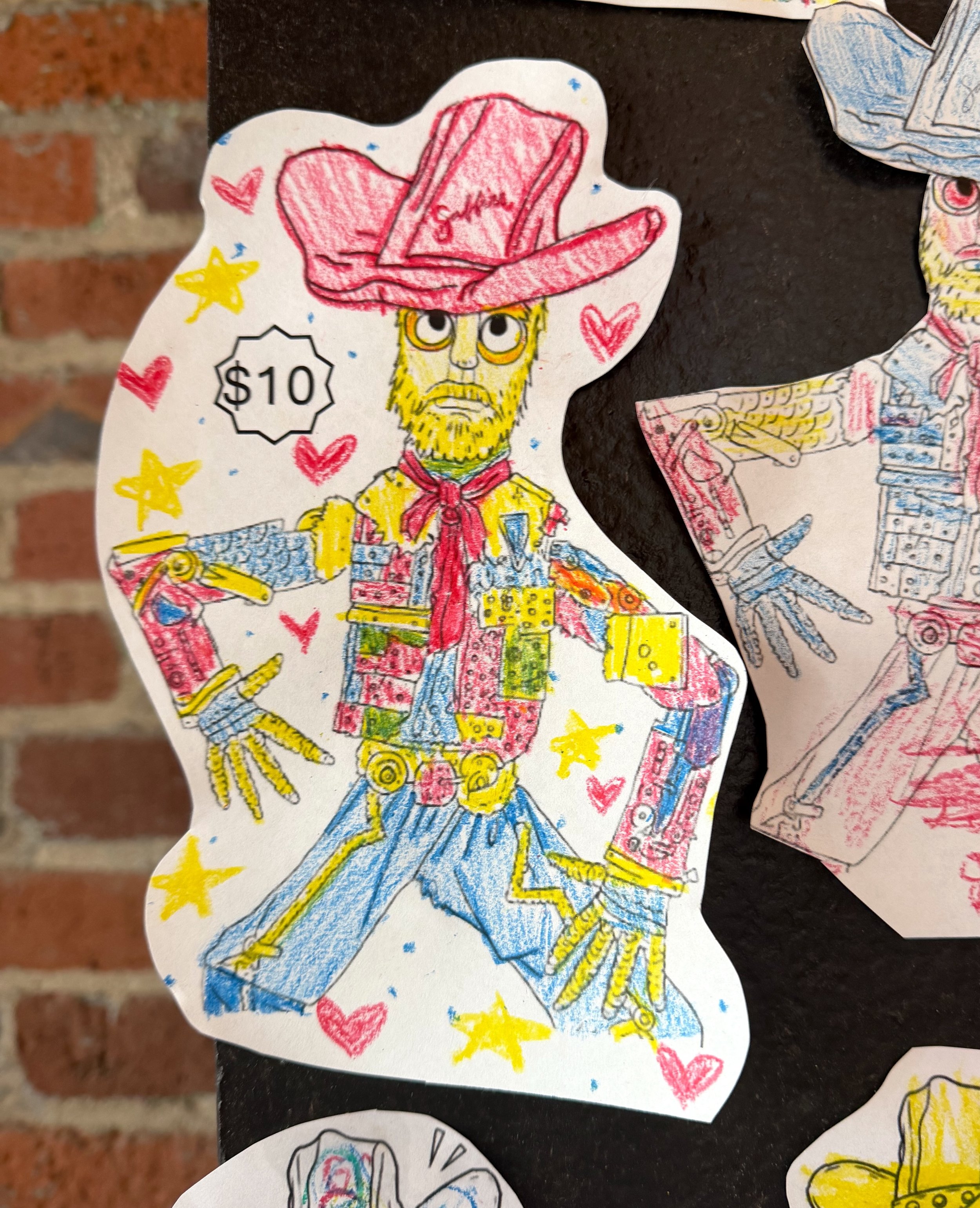 Can you spot the difference between these drawings and the original?⁠
⁠
A blank drawing of the cowboy in our lobby is on the kid&rsquo;s menu, and we love hanging up these colorful masterpieces! Just ask for a kids menu and some crayons at the host s