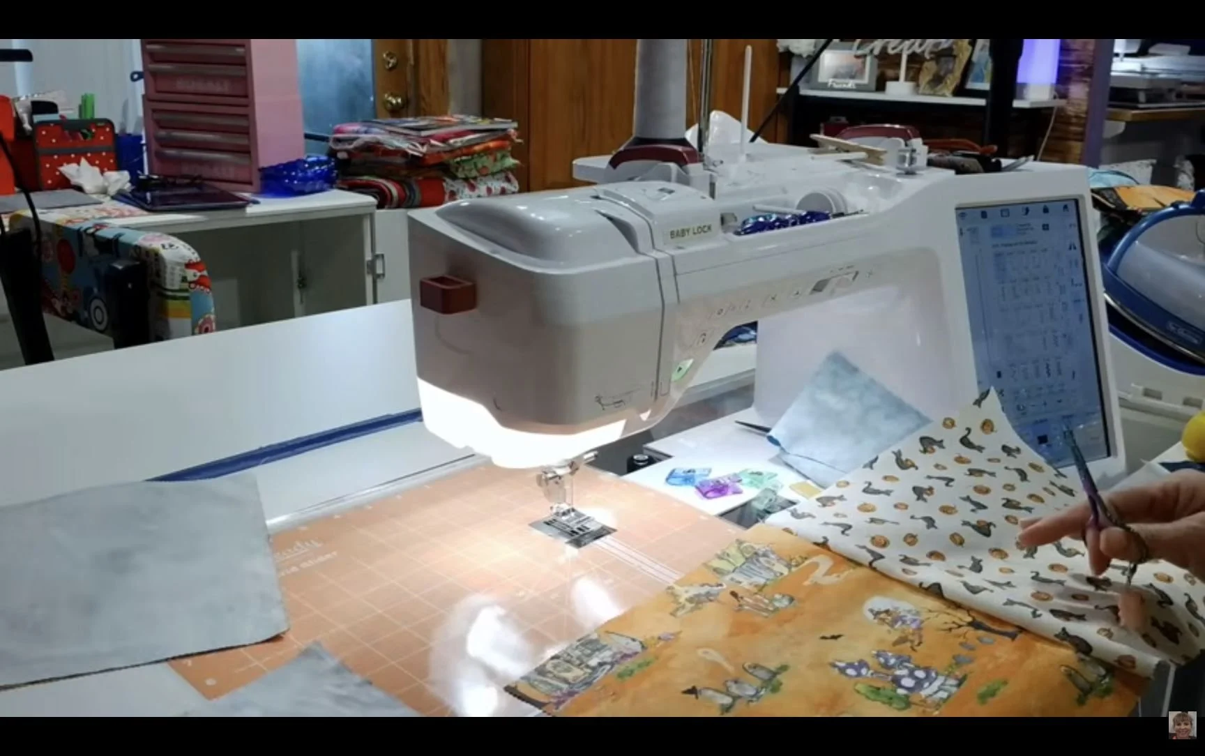 Halloween fabric squares being pieced at the sewing machine during Sew & Tell LIVE.