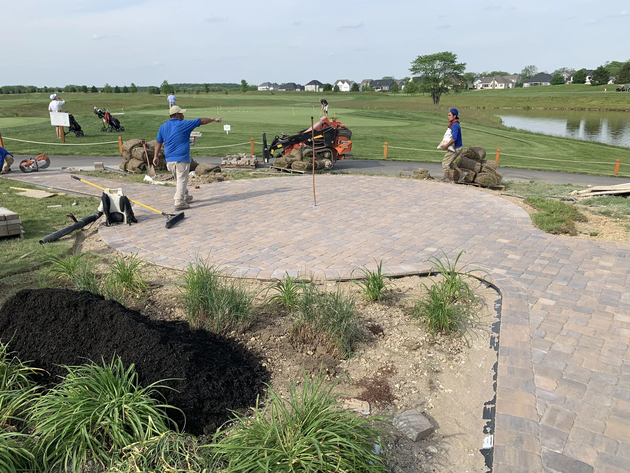 Landscaping within a golf course taking place