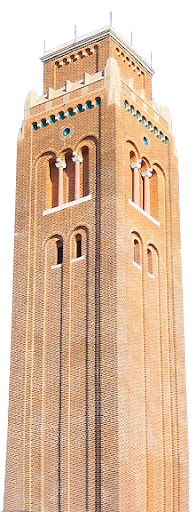 A tall, historic brick tower at Rice University with decorative arches and battlements at the top, set against a clear blue sky. Rice Christian Study Center.