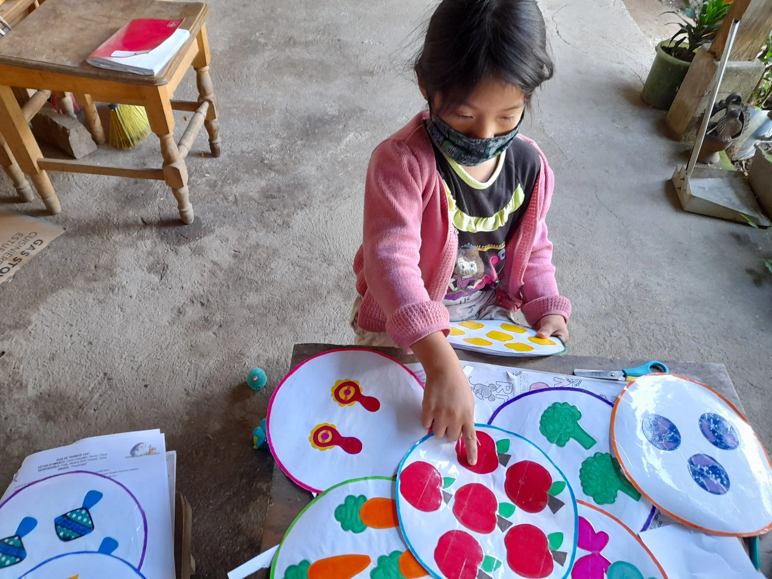 girl with mask learning at home.jpg