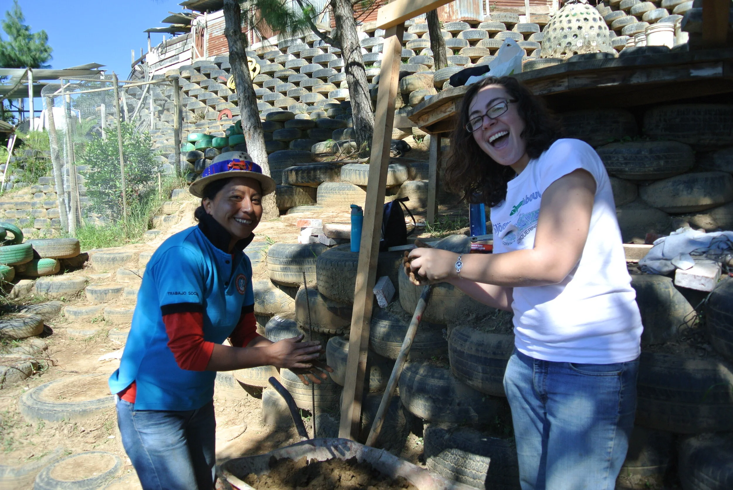 volunteers with cob oven.JPG