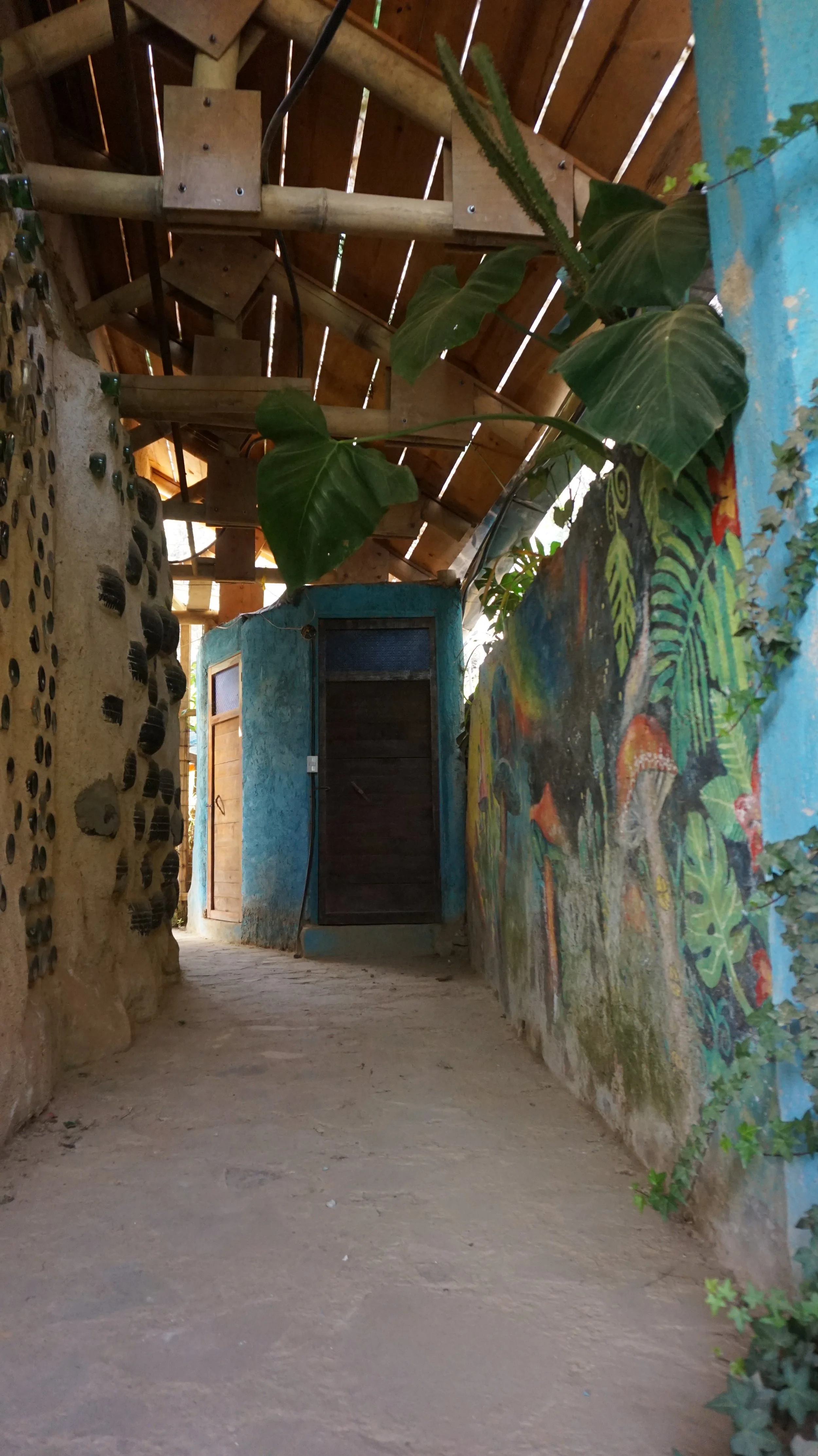 Hallway to additional showers and bathroom