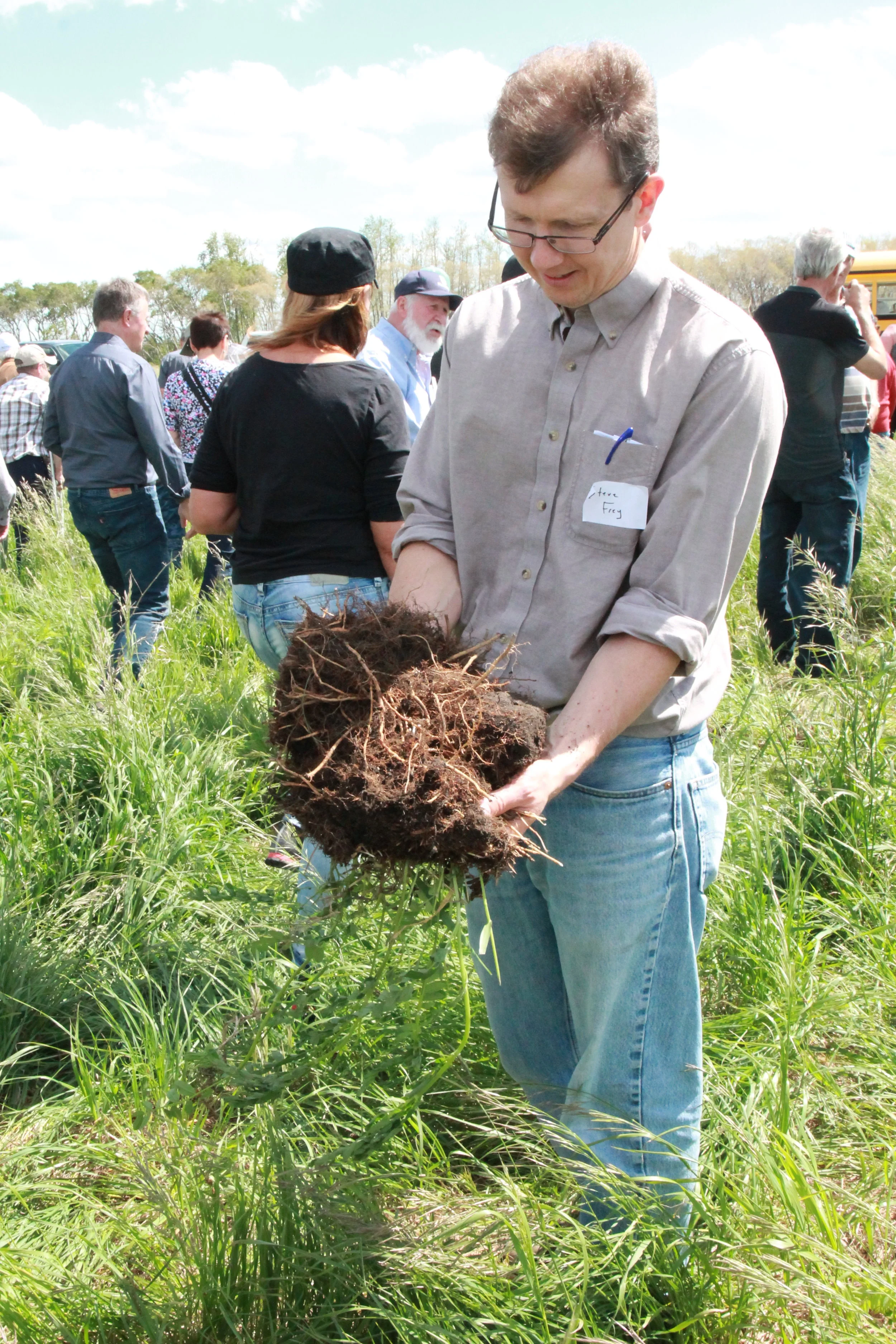 Steven Frey with sod sample.JPG