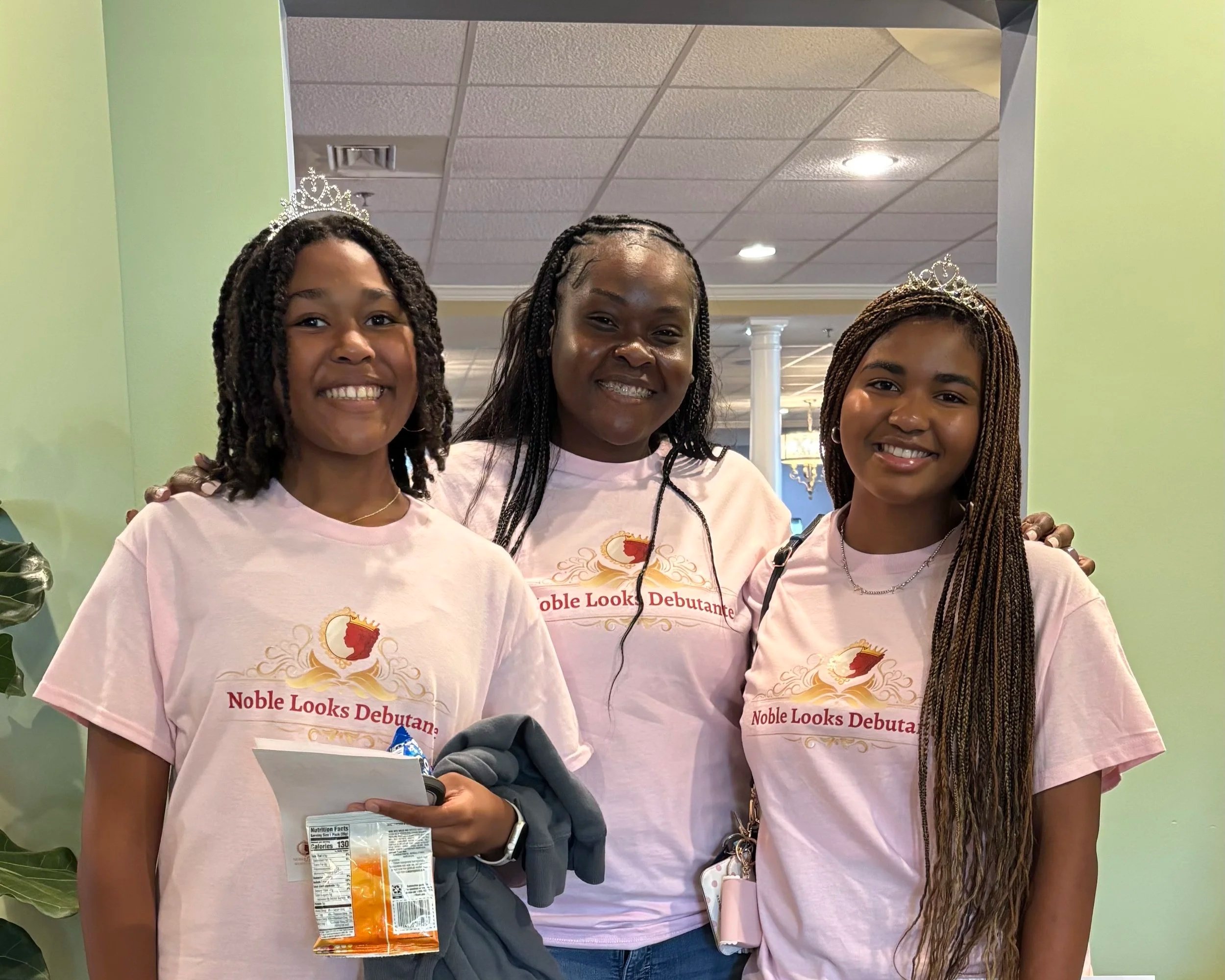 NLD Founder posing with Debutantes.