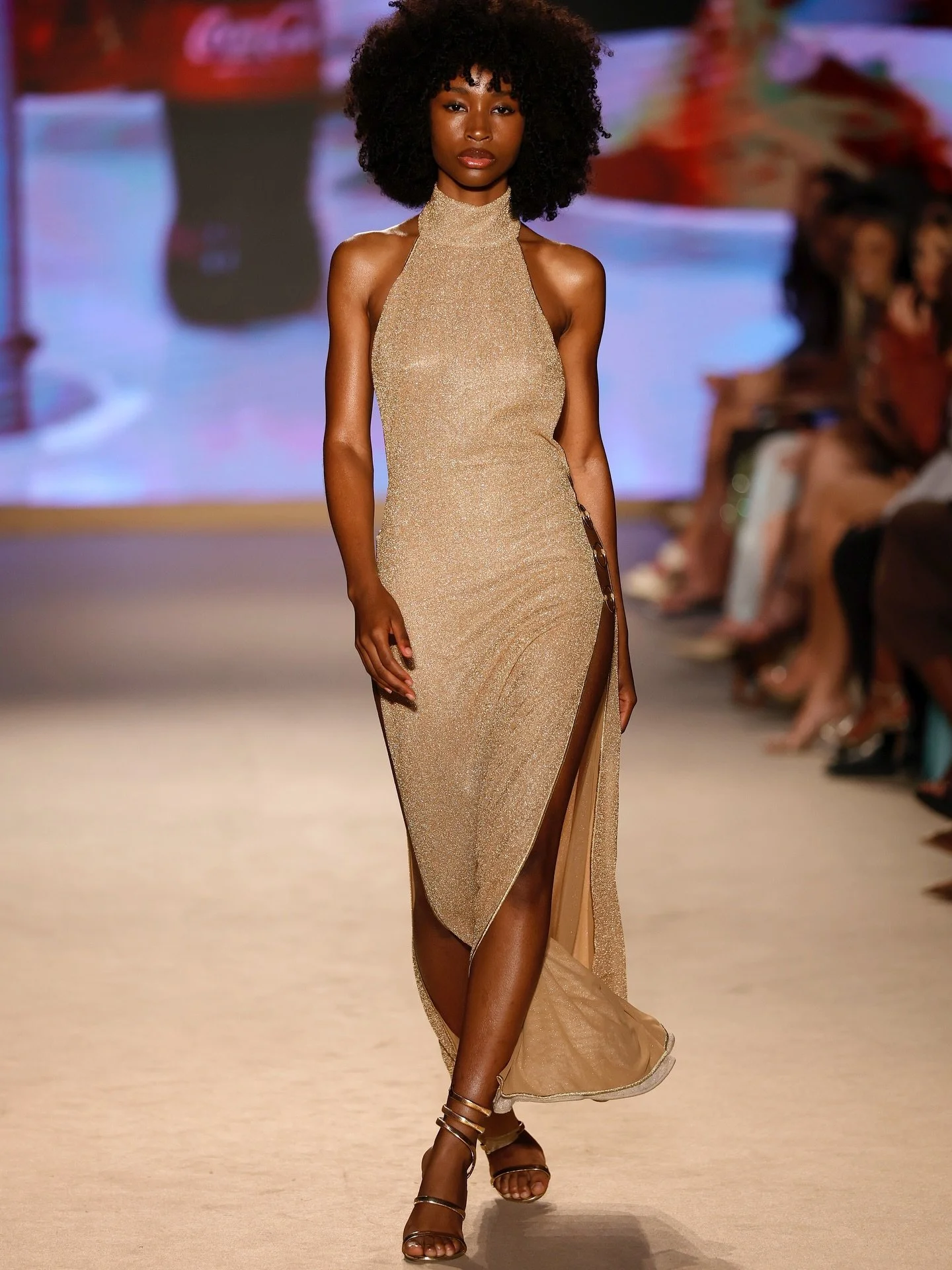 @feliciahfitz in a high-neck and high-shine dress by @osereeswimwear