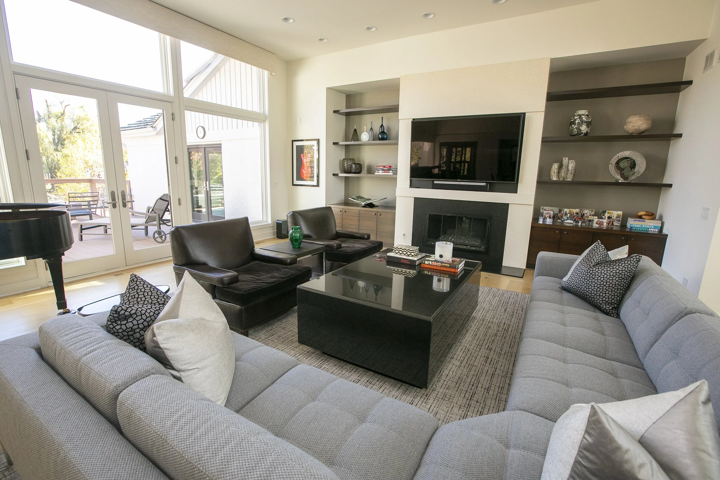 The room in this photo features a clean, modern, and sophisticated styling with neutral tones. 