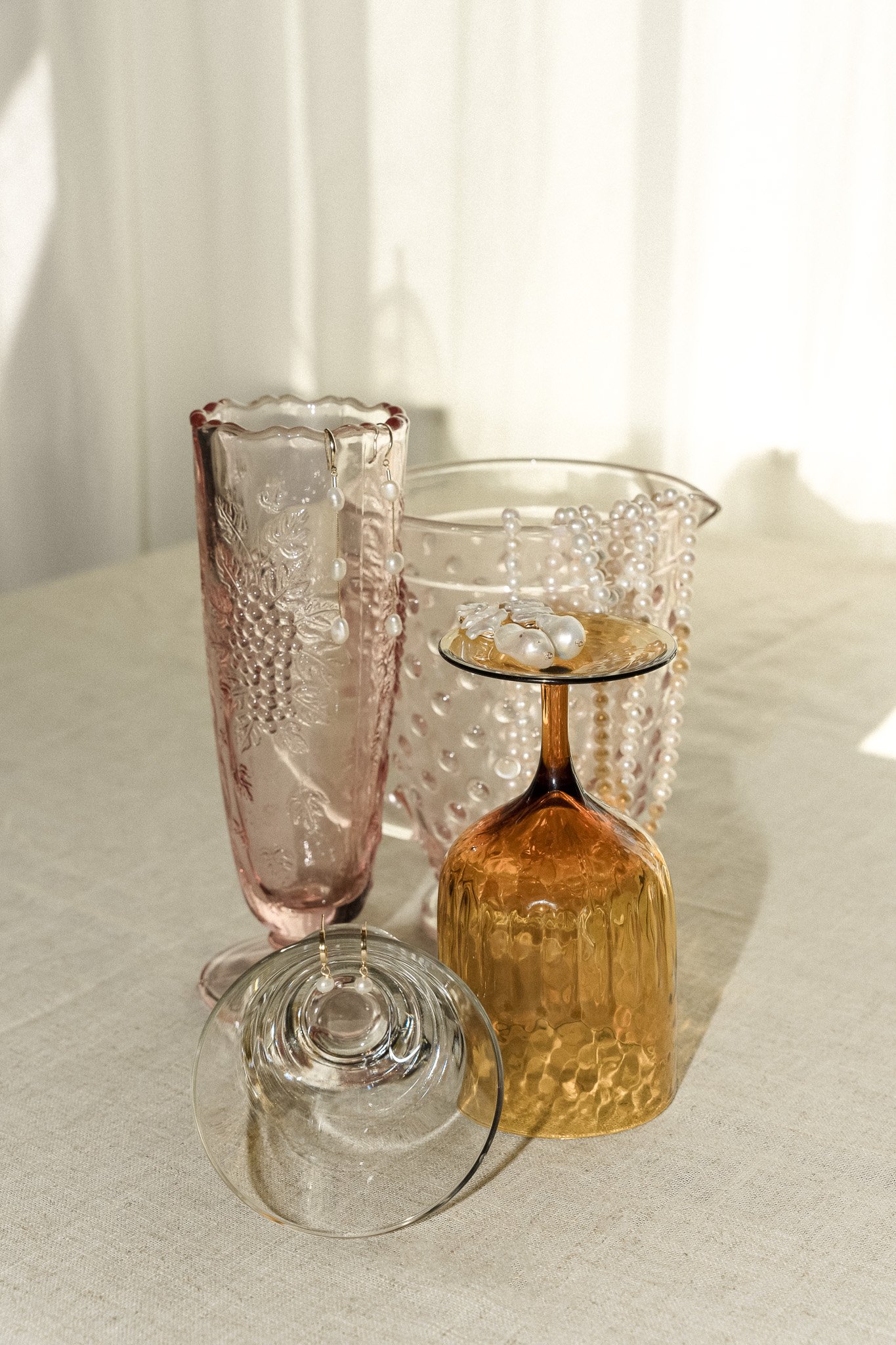 Decorative glassware and pearls on a table