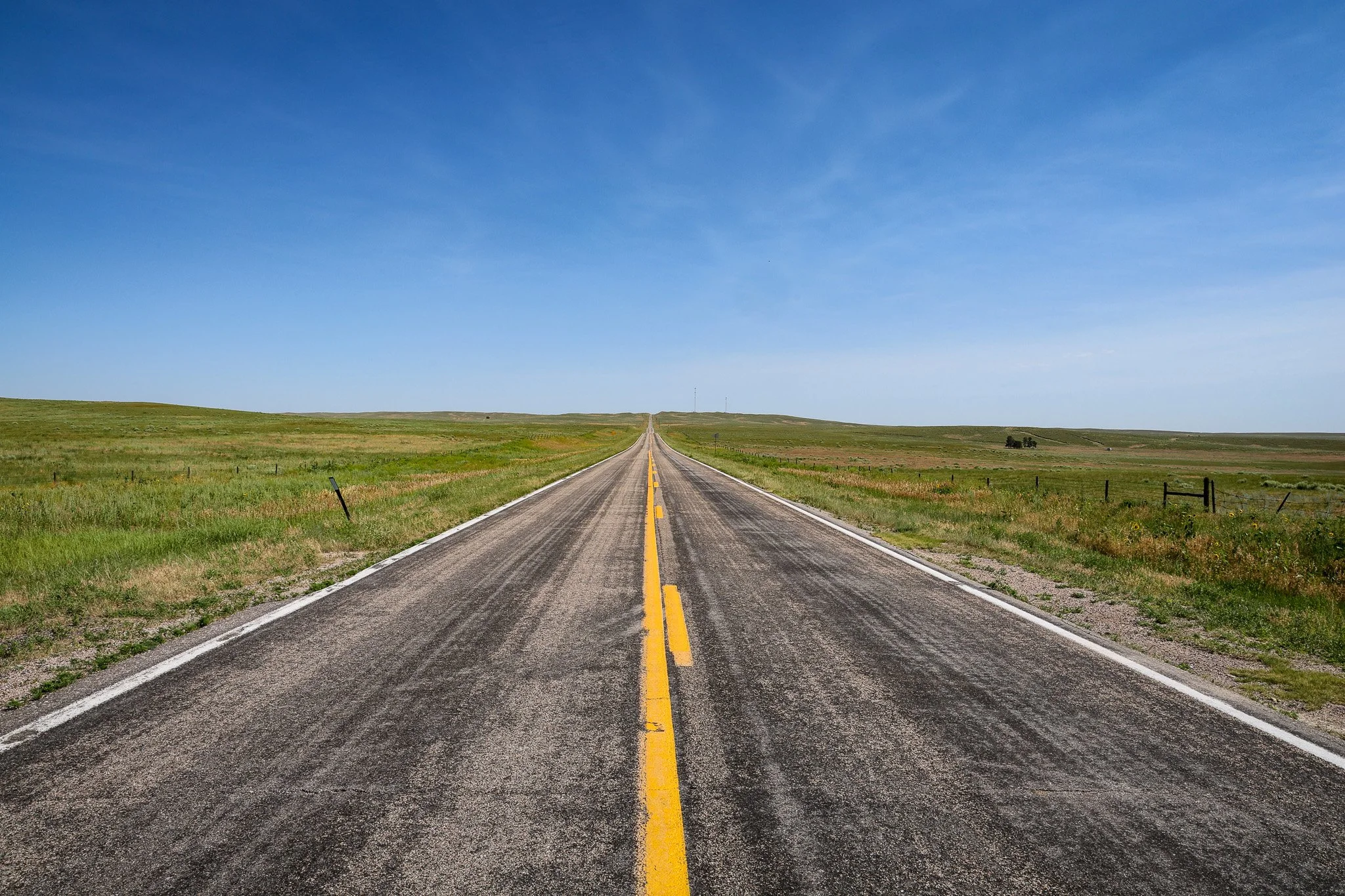 Open highway in western Nebraska. I have a hard time not pulling over on a stretch of road like this.