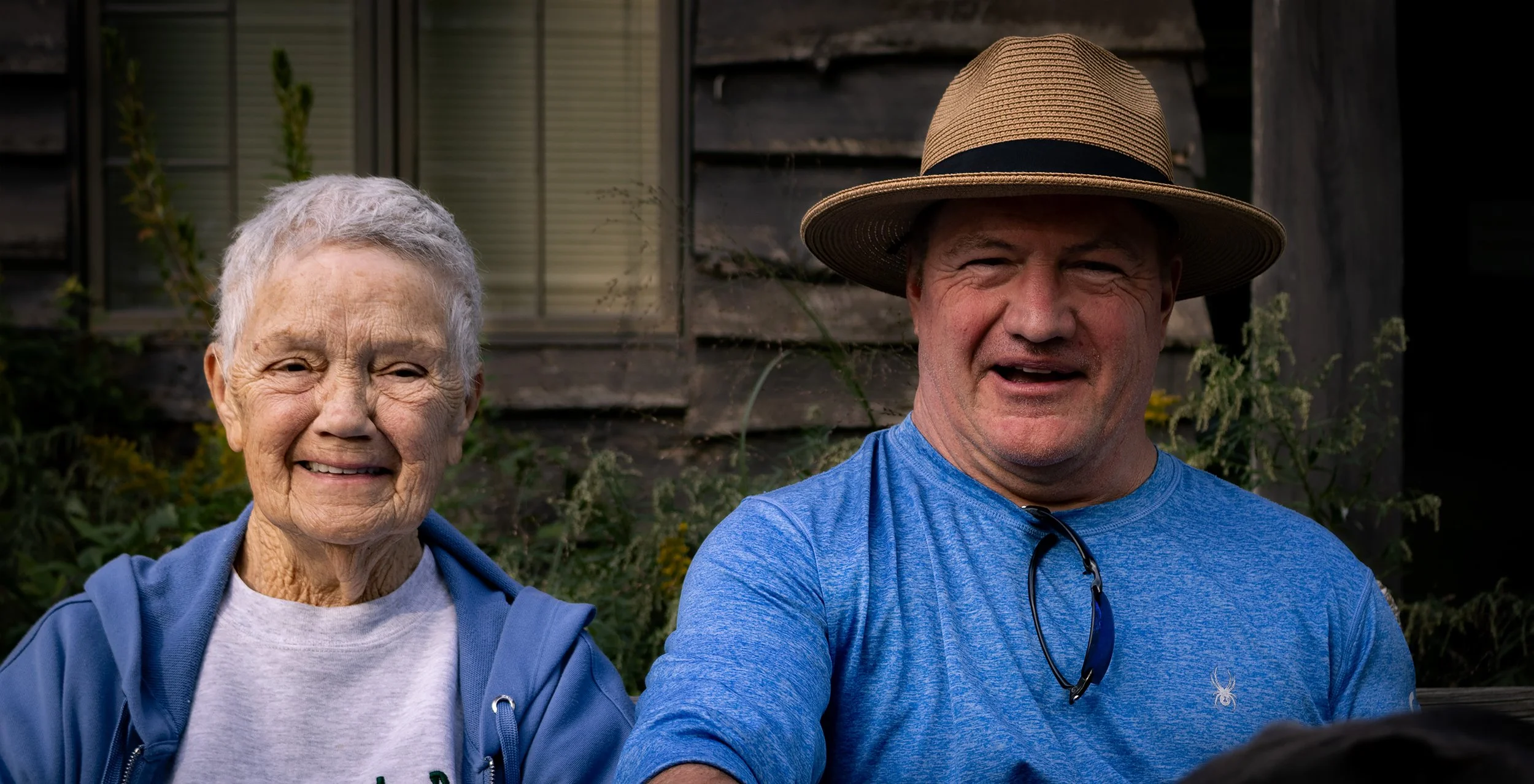“Mother and Son”
The man in this photograph was walking his dog around when I asked to take his photograph. He accepted but quickly sat down next to his mother, who was sitting on a bench nearby, wanting her to be part of the photo as well. 