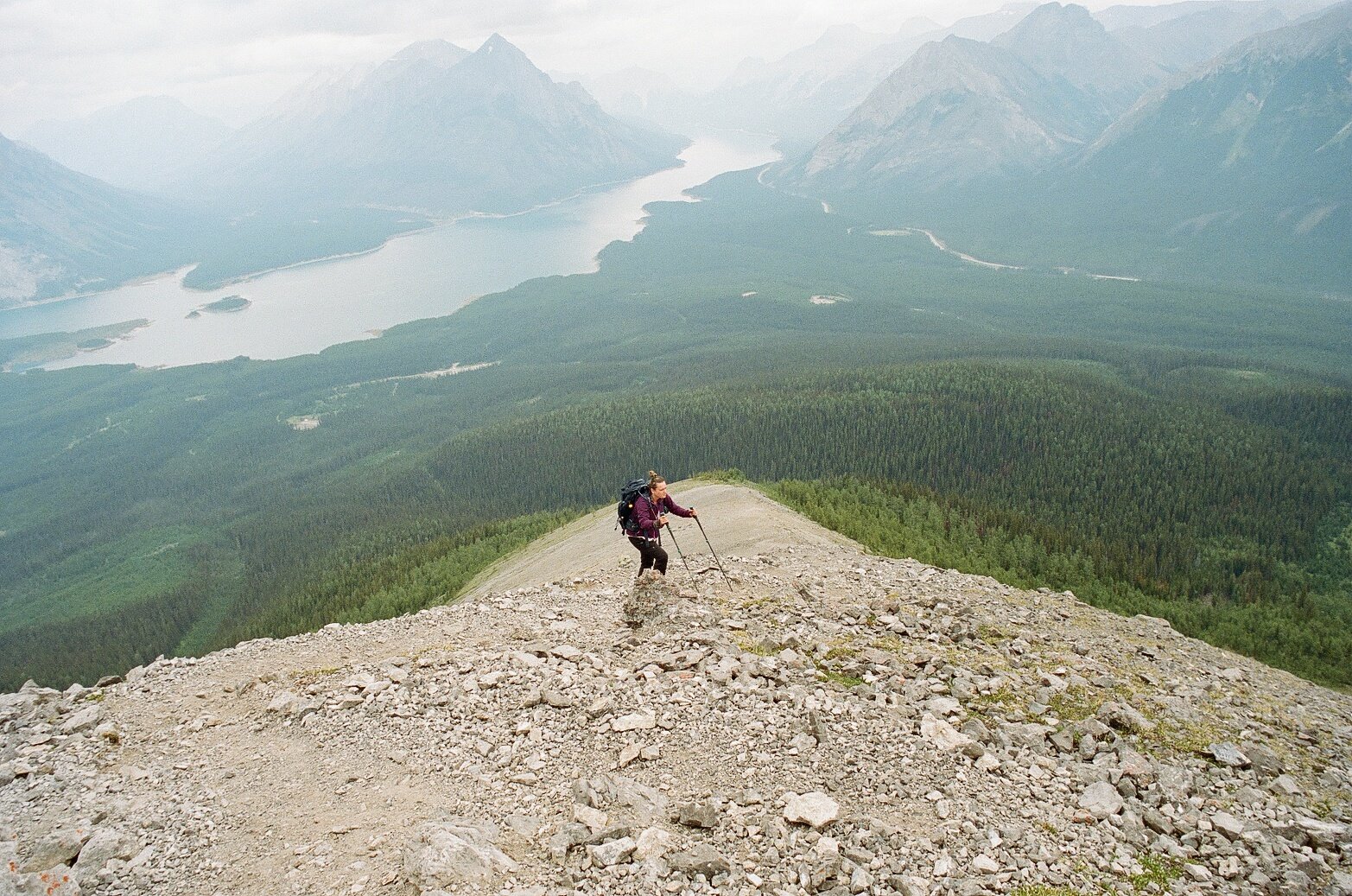 Hiker surrounded by mountains