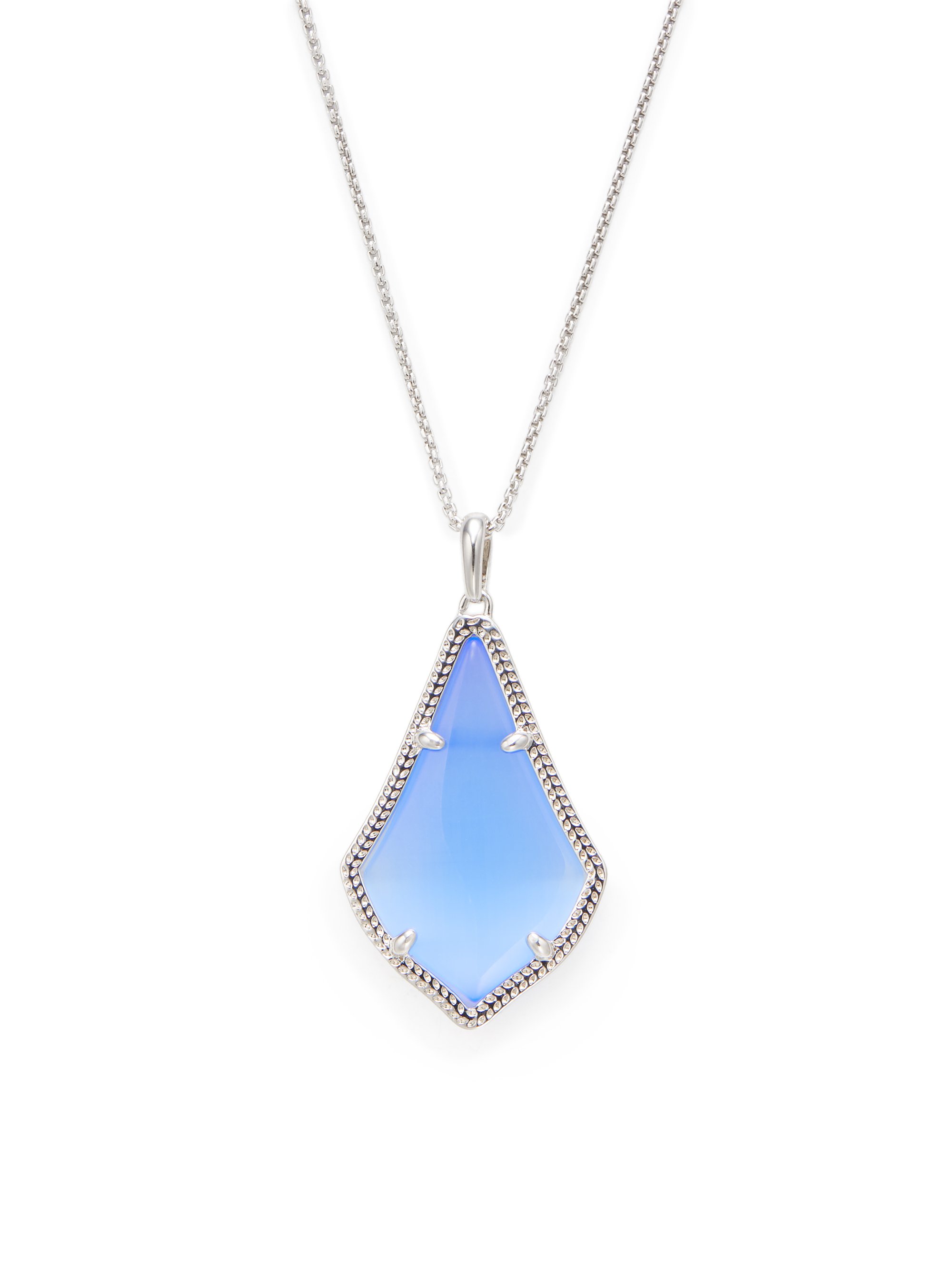 Silver necklace with a large, light blue geometric pendant outlined with small clear stones on a white background.