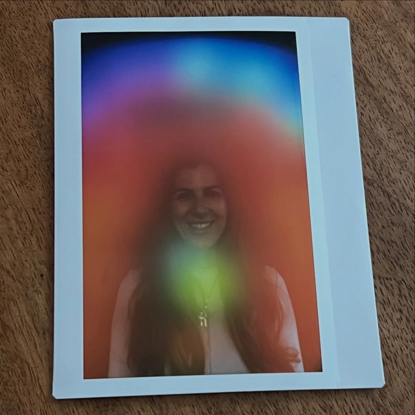 This aura photograph shows a saturated concentration of color and light around the throat area. In aura photography, this region is commonly connected to communication, listening, self expression, and how we use our voice in the world. When the throa