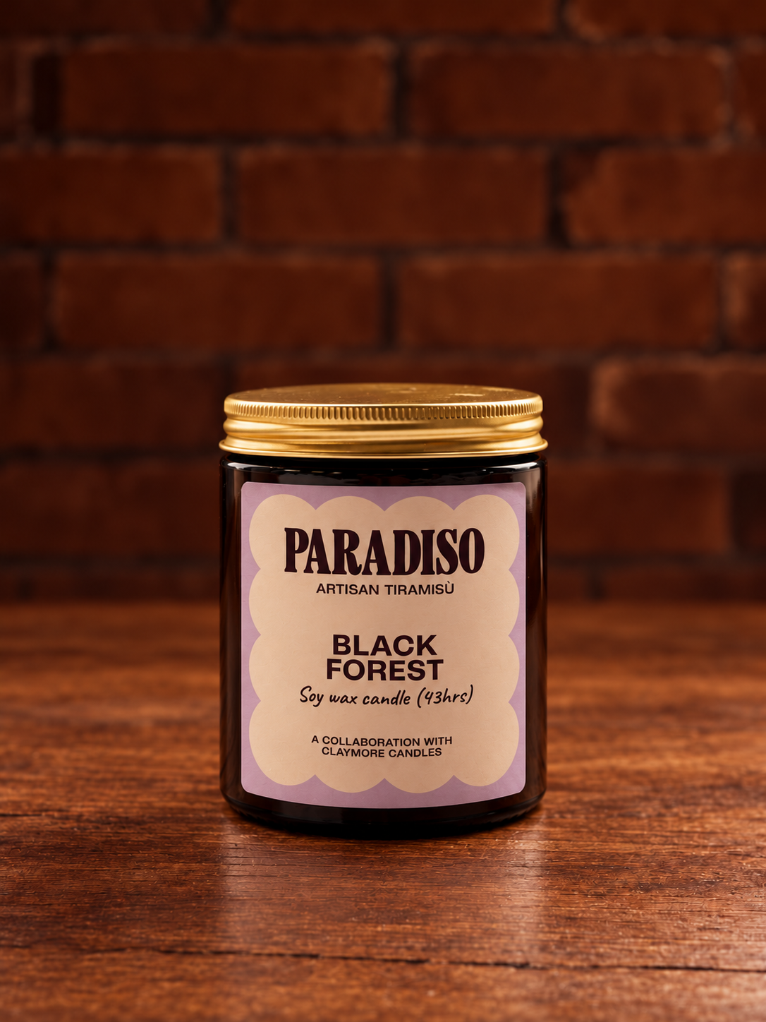 Black Forest Candle on Dark Wood.png