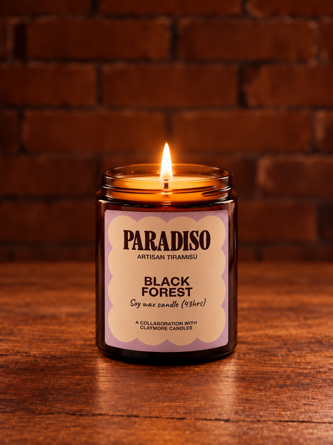 Lit Black Forest Amber Candle.png