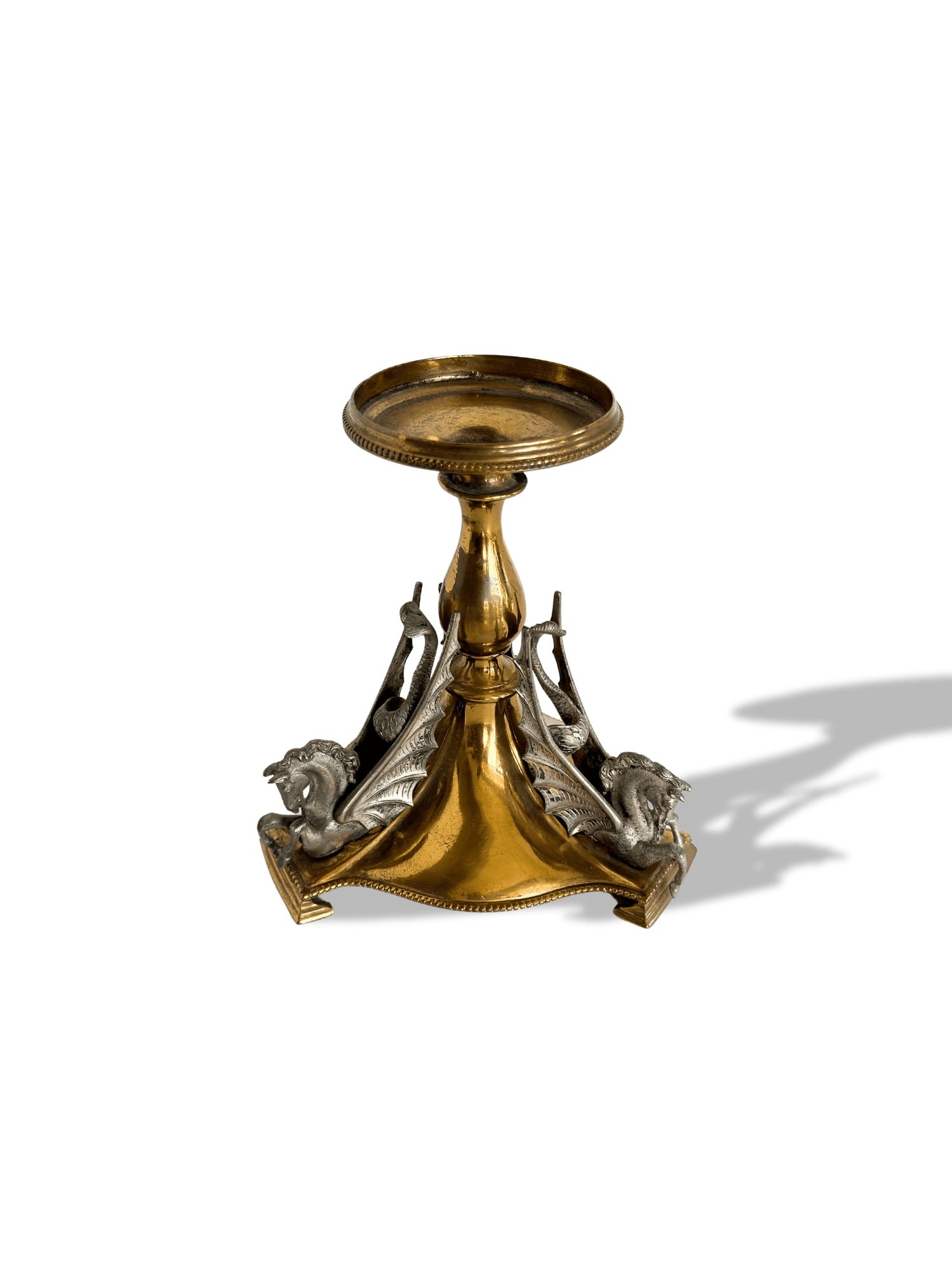 Antique brass Hippocampus candlesticks with silver winged horses at Studio TMS in Chicago. Perfect for collectors or home decor.