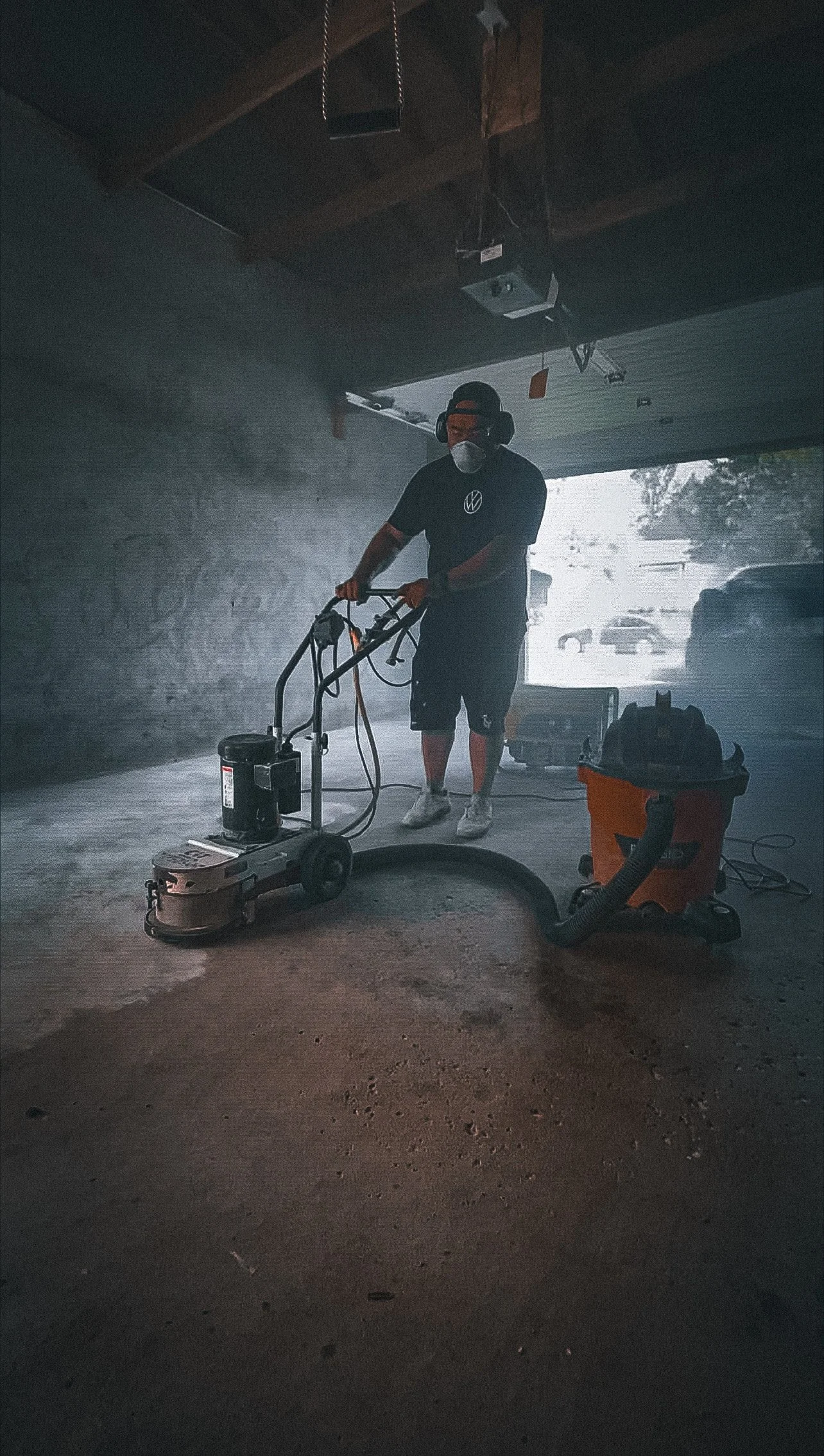 winnipeg man installing epoxy in garage