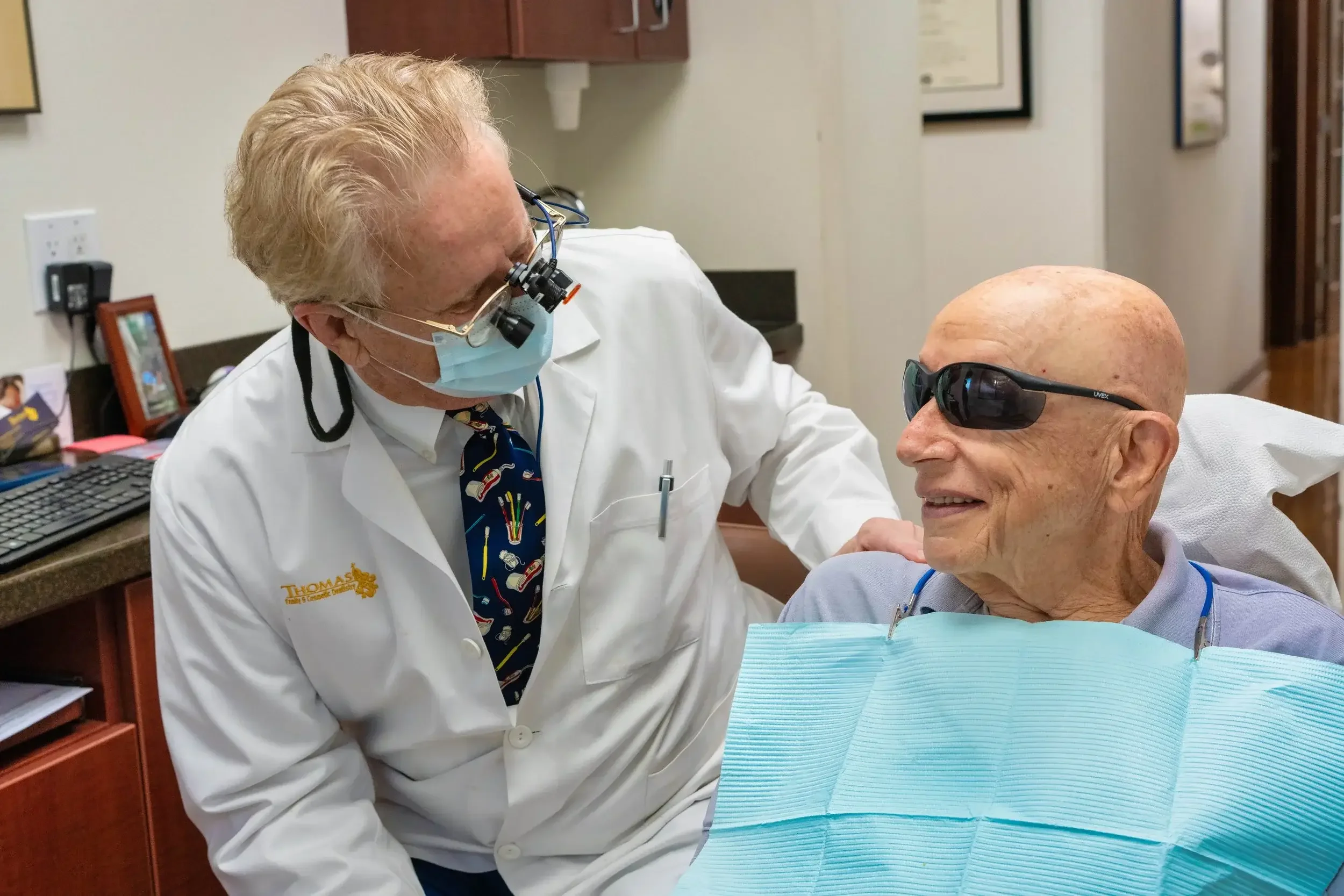 Doctor examining an elderly patient in a clinic