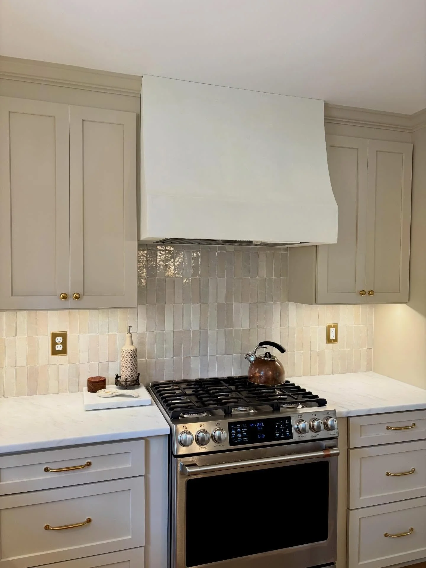 Custom Venetian plaster hood vent.

Honestly, this is a good picture but it does not do justice to the natural beauty and tones that come from this type of material. What a fun project!