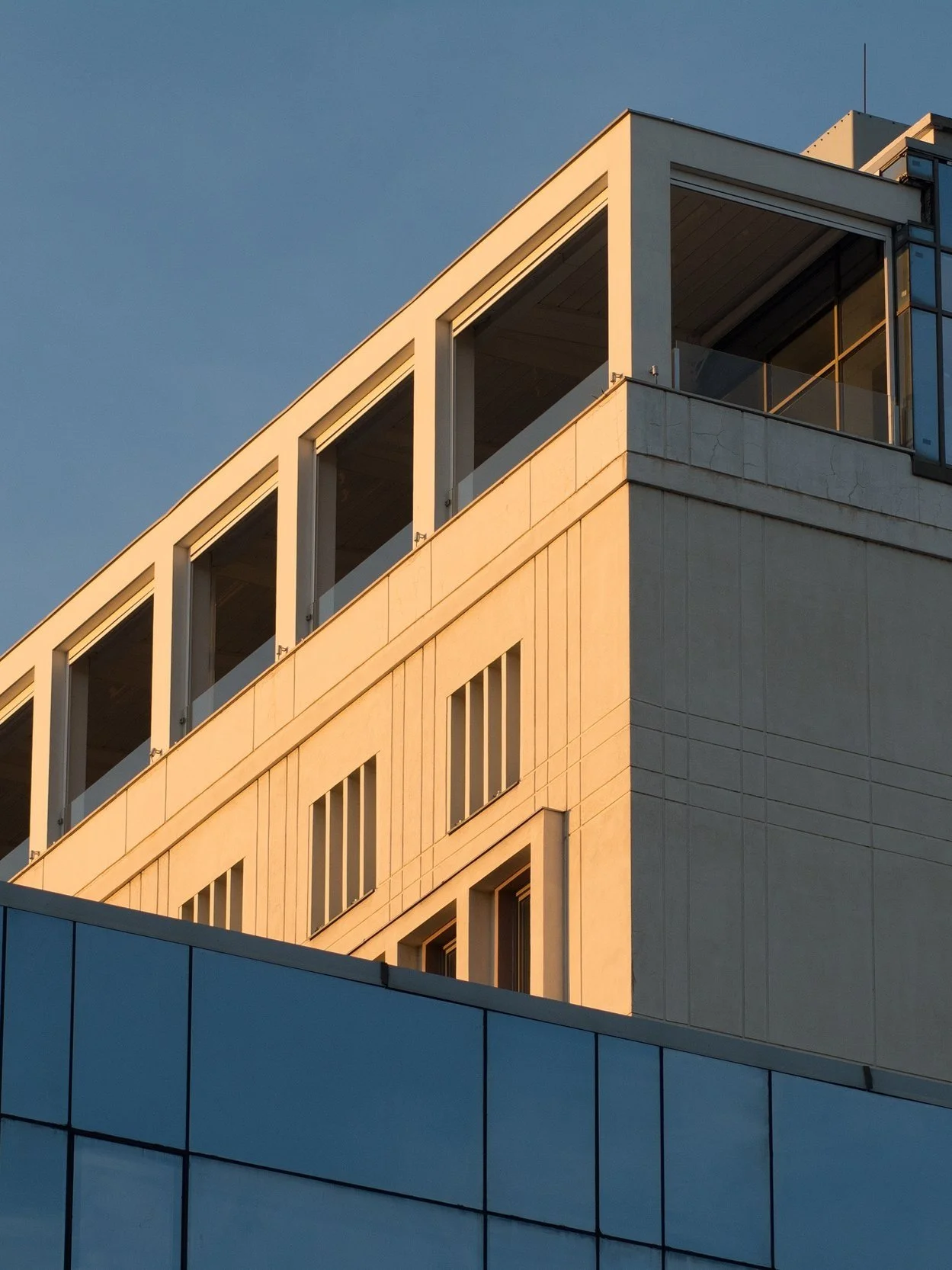 modern-building-with-blue-glass-windows-under-the-2023-11-27-05-20-55-utc.jpg