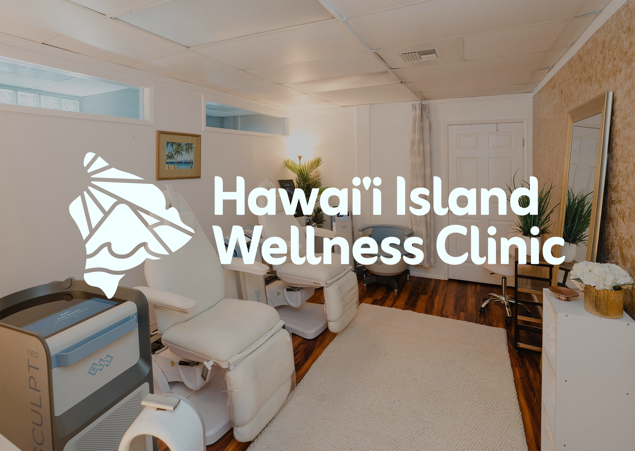 Interior of a wellness clinic with treatment chairs, a mirror, plants, and decorative items, featuring a logo and text for Hawaii Island Wellness Clinic.