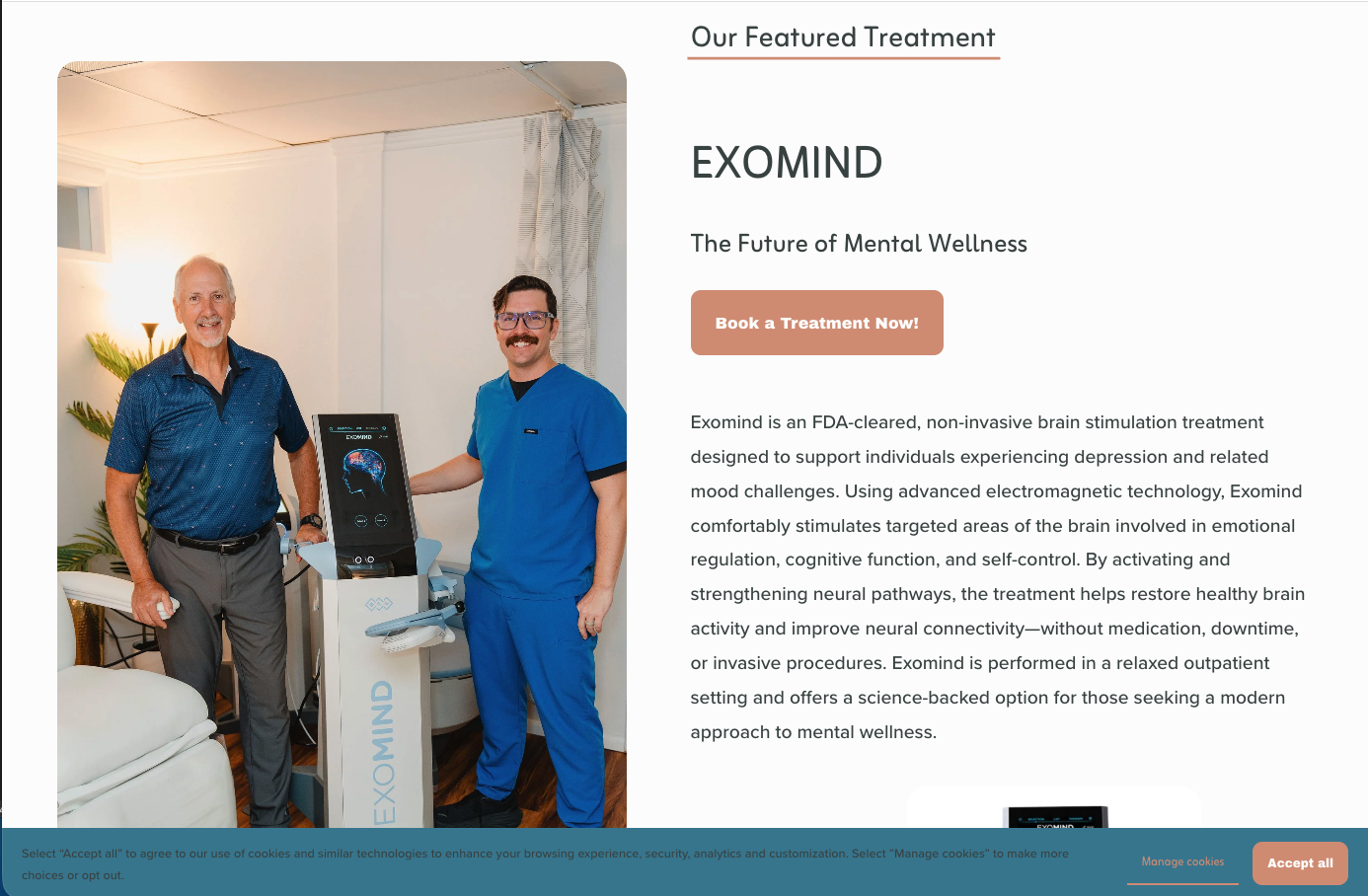 Two men standing next to a medical device labeled 'EXOMIND' in a room with a standing lamp and a plant. One man is older with white hair, wearing a blue shirt, and the other is younger with dark hair, wearing blue medical scrubs and glasses.