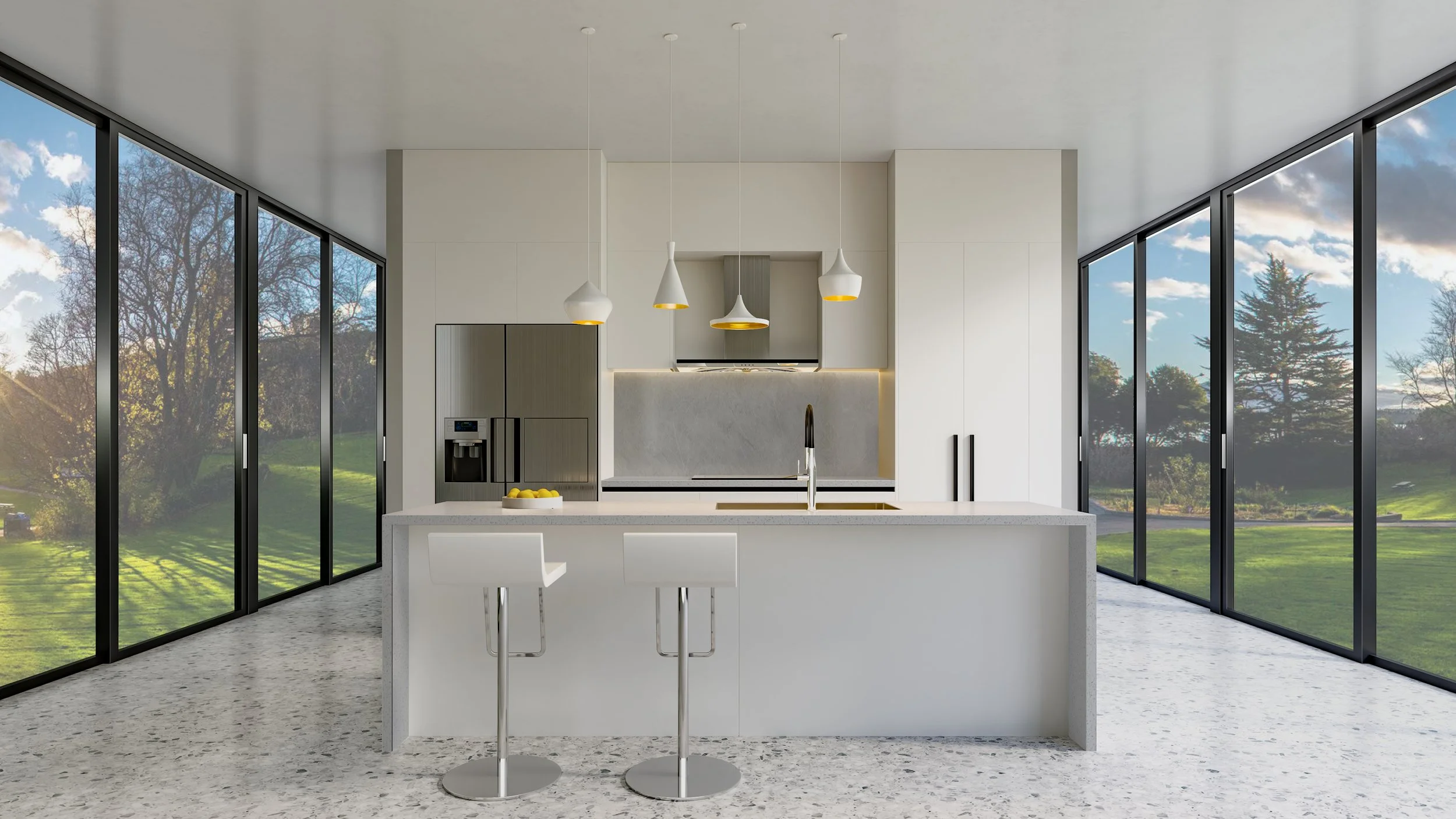 Modern kitchen with white island and contemporary pendant lights, surrounded by large glass windows with a view of trees and a grassy landscape.