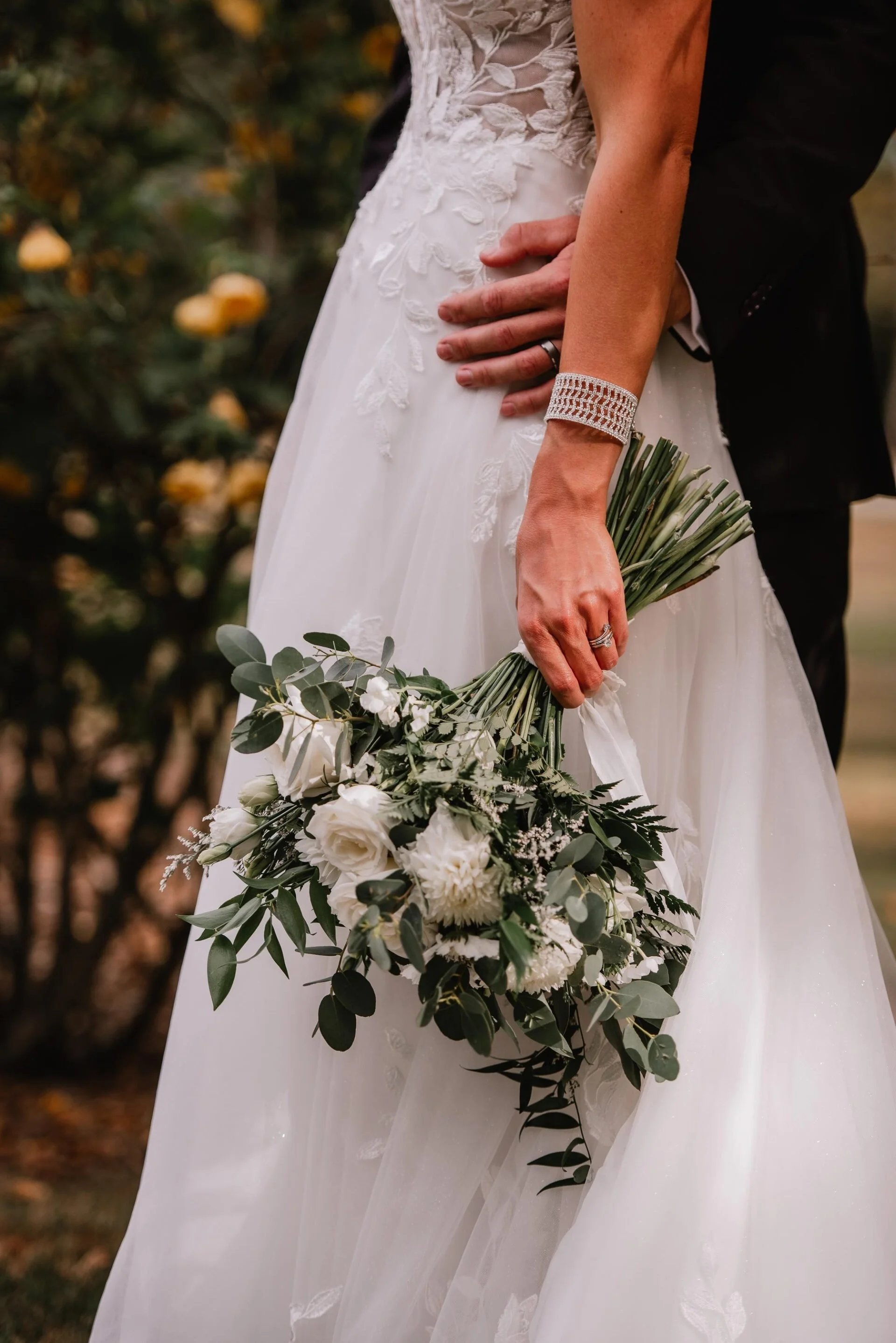 Bride and groom with green and white bouquet from Cushla & Harry's wedding at Pemberton Gardens photographed by Joseph O’Sullivan Photography