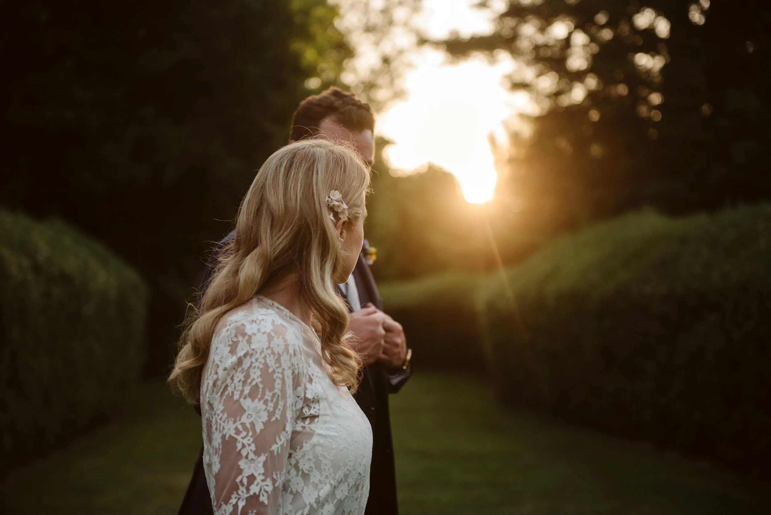 Bride and groom in profile with gentle evening light from Georgina and Matthew's wedding at Pemberton Gardens photographed by Bethany Howarth Photography