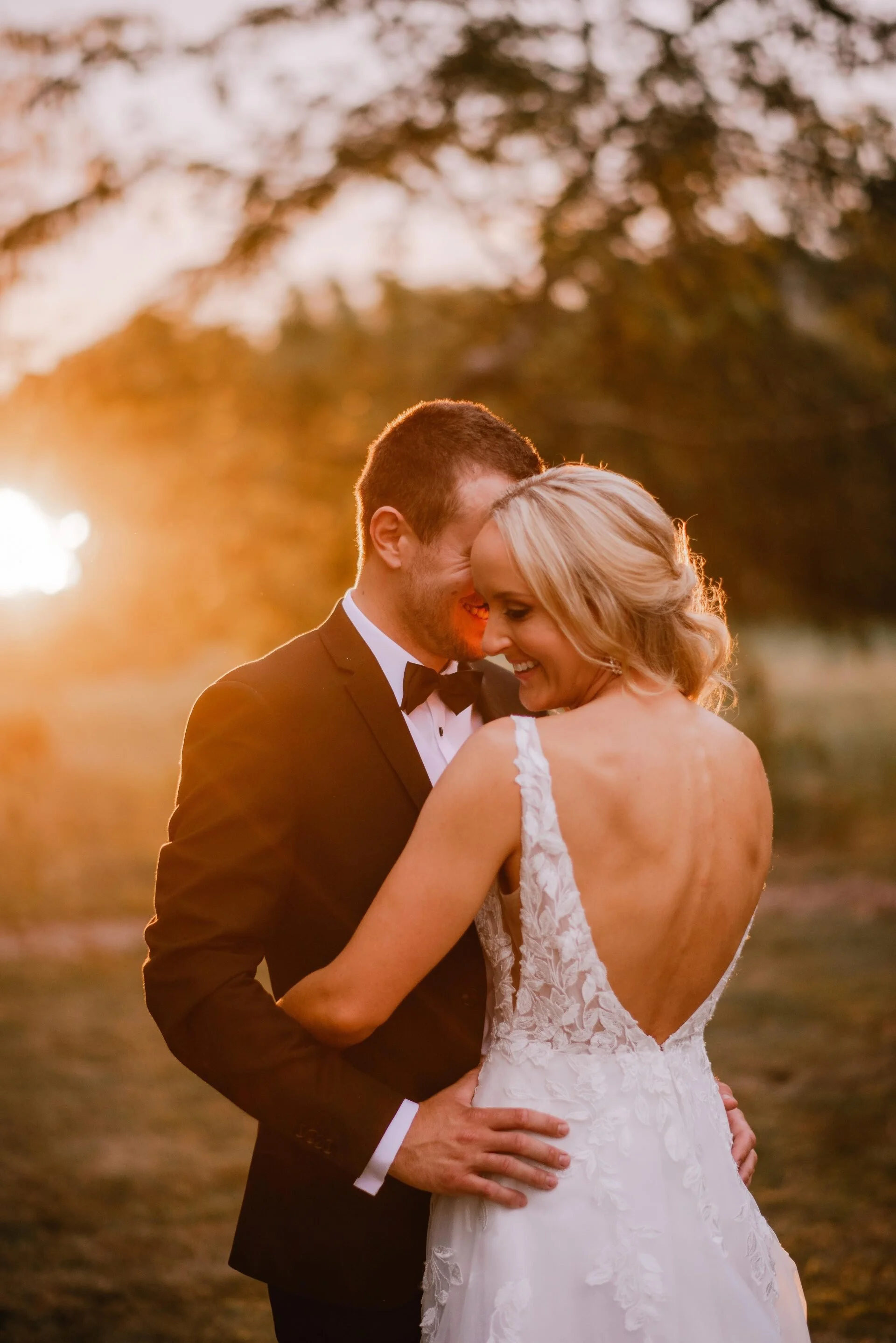 Bride and groom in golden light from Cushla & Harry's wedding at Pemberton Gardens photographed by Joseph O’Sullivan Photography