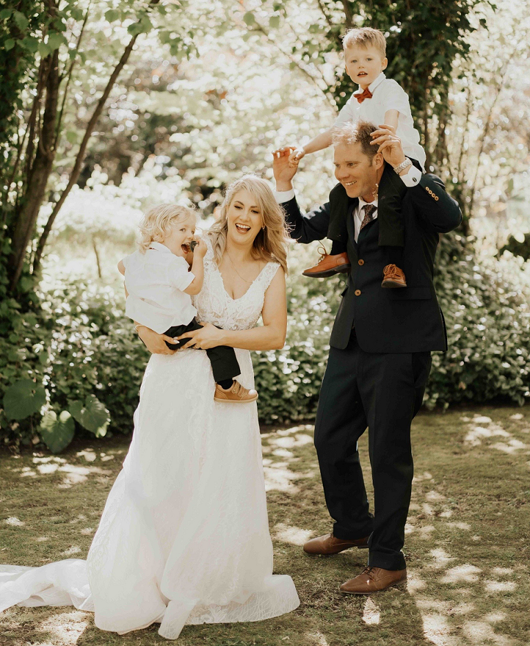Bride and groom with children wearing red bow-ties from Kirsty & Cameron's wedding at Stonebridge photographed by Sarah Clements Photography