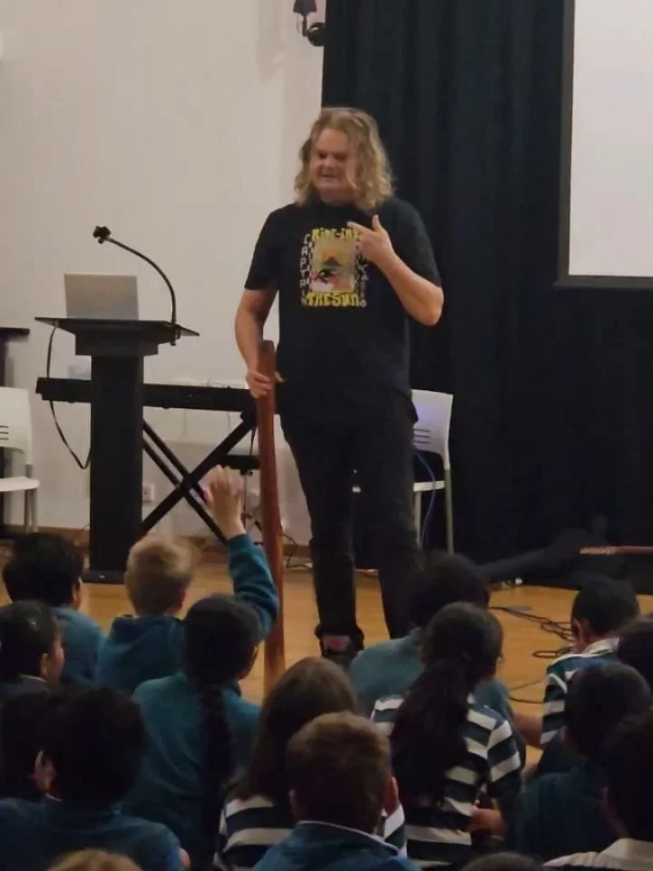 Last Thursday, we had a special visit from proud Yorta Yorta man and musician @scottdarlow and his daughter, Kiah. As part of Harmony Week, they shared Aboriginal culture with our Primary Years students, performed songs on the guitar and yiḏaki (comm