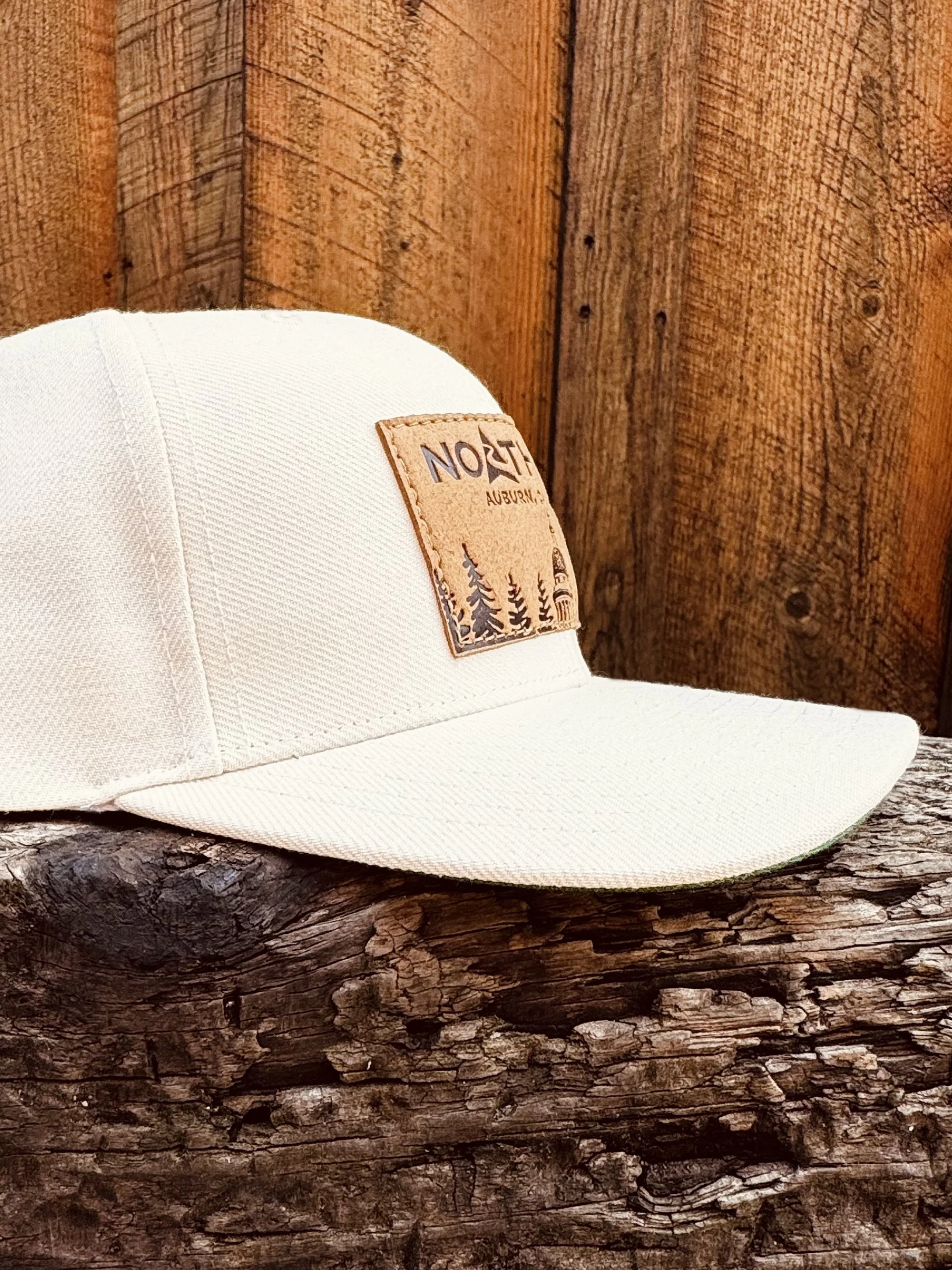 CourthouseLeatherPatchHat-Ivory-Profile-WoodBG.jpg