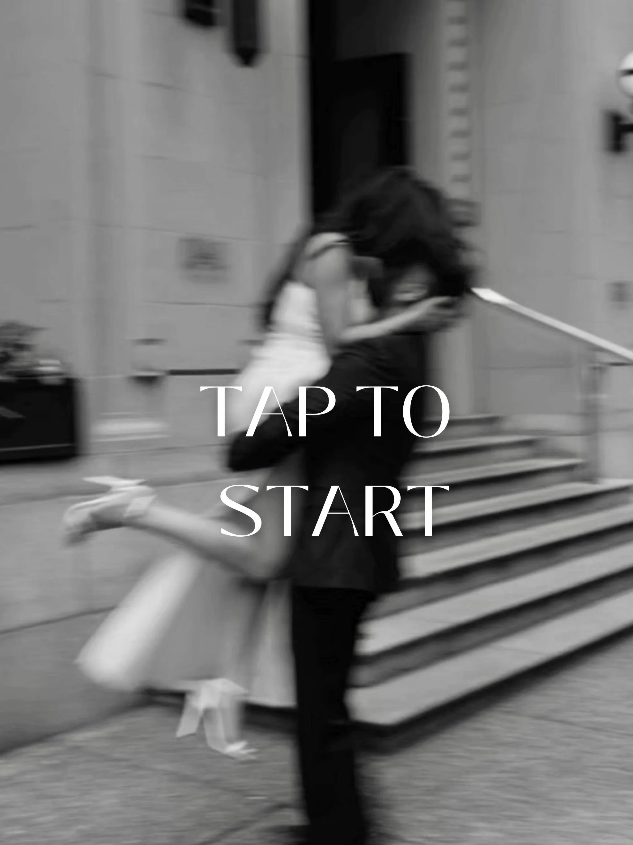 Blurred black-and-white photo of two women hugging in front of a building with stairs. Overlaid text says "TAP TO START".