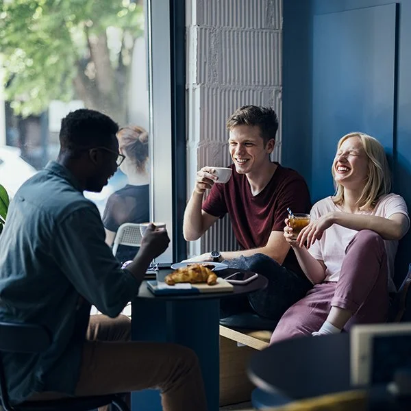 Residents enjoying a community space, representing improved satisfaction and convenience from reliable smart access control.