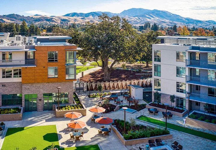 Bocce courts, BBQ areas, lawns, and seating blend with the natural landscape and create comfortable spaces for outdoor dining, socializing, and relaxing in the elements.