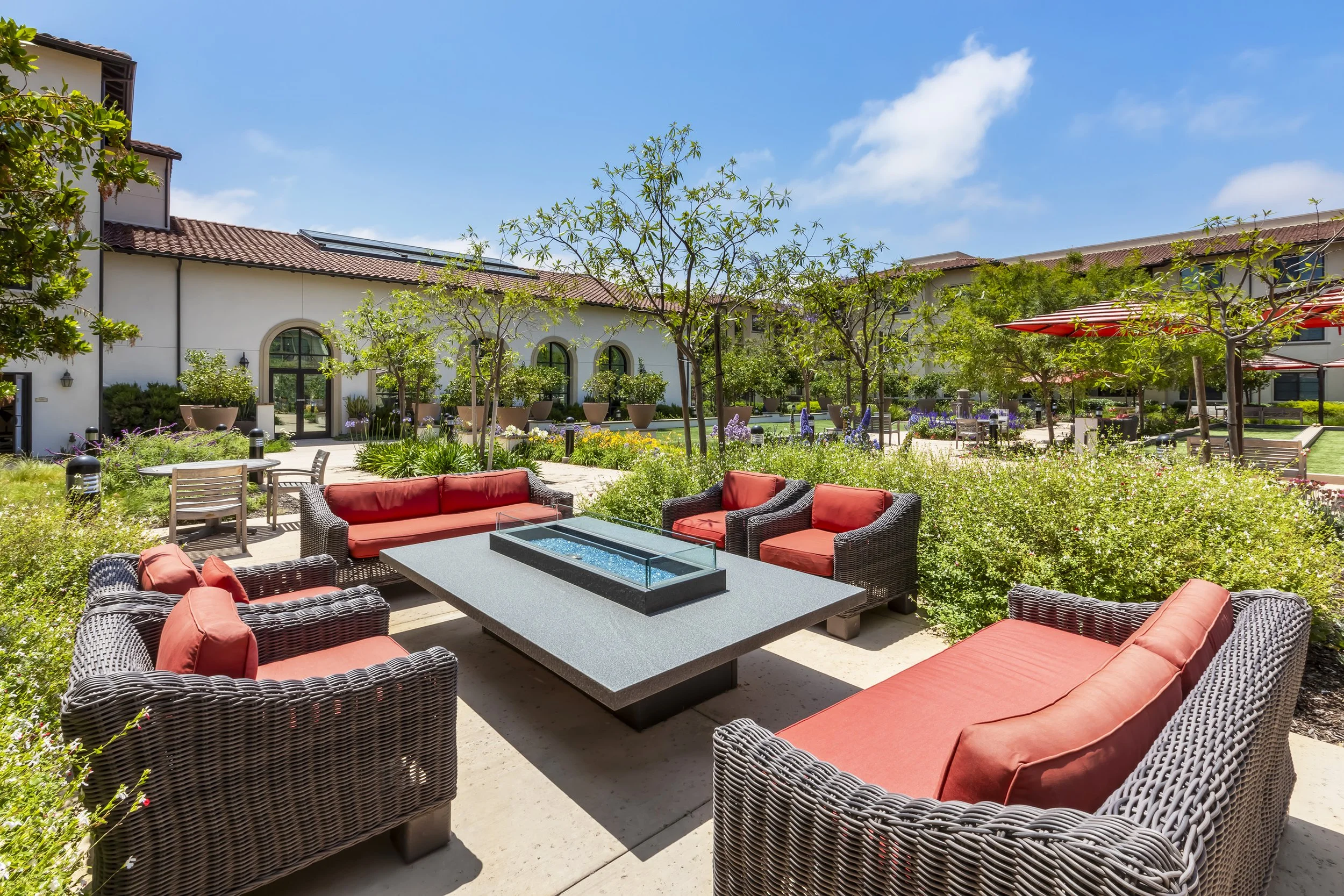 Outdoor lounge with a fire table and comfortable seating encourages gathering