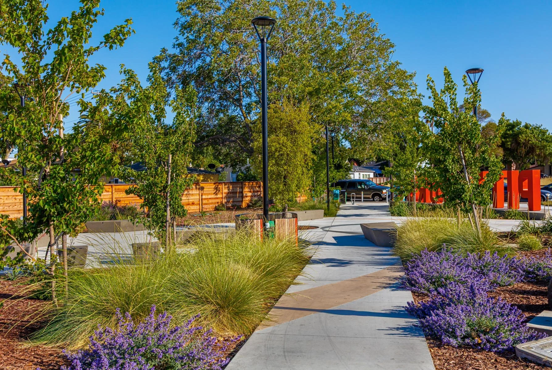 Planting design matches the diagonal pattern across the entry from N. Parkside Drive