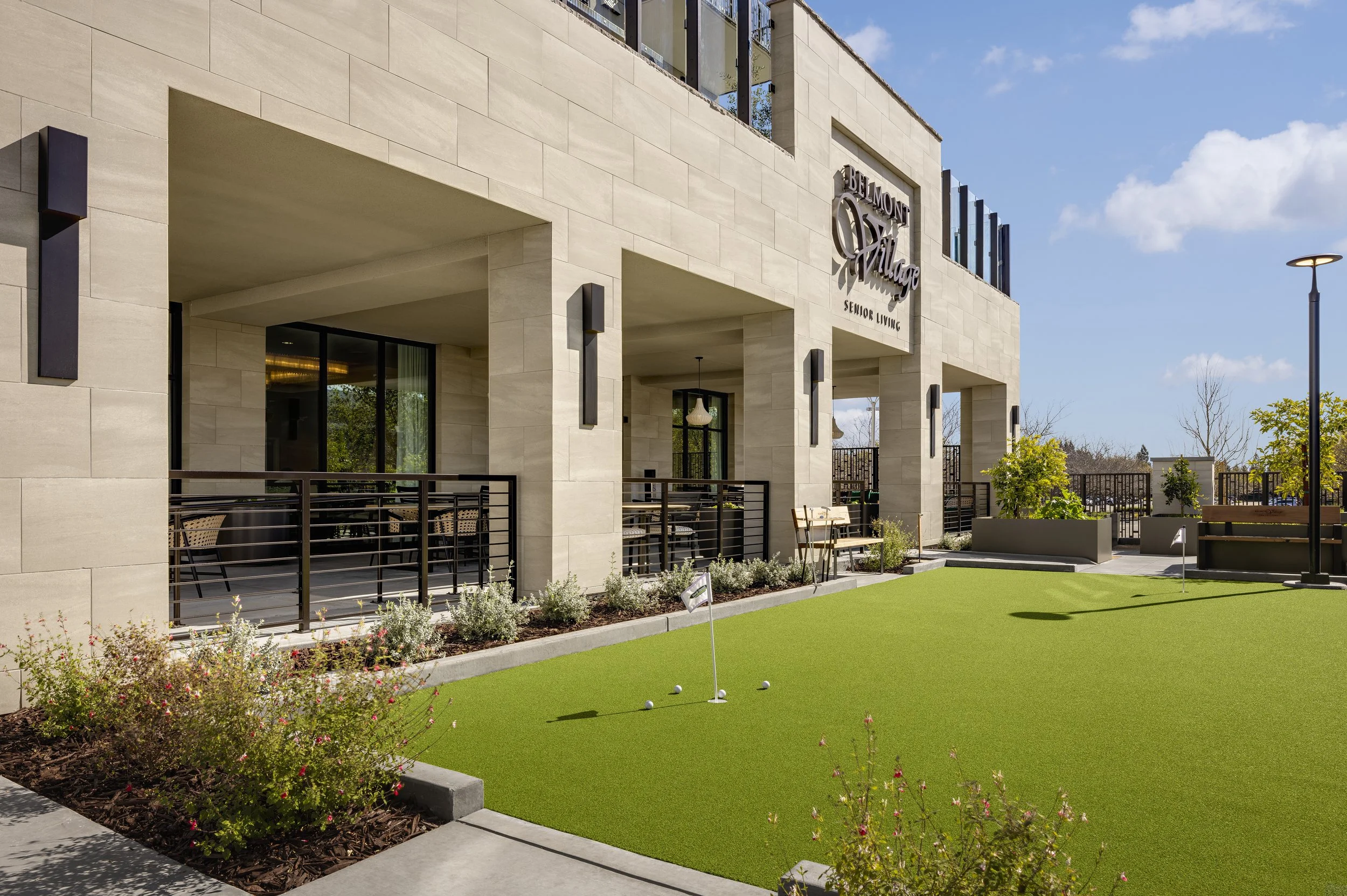 The central courtyard combines recreation, outdoor dining, and planting to strengthen the connection between the building and the landscape while encouraging daily activity. Credit: Zack Benson Images