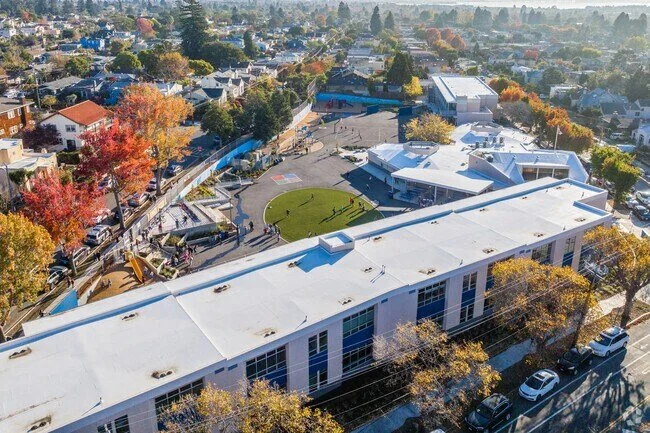 At the heart of the campus, a flexible central lawn creates space for recreation, school events, and informal outdoor gathering.