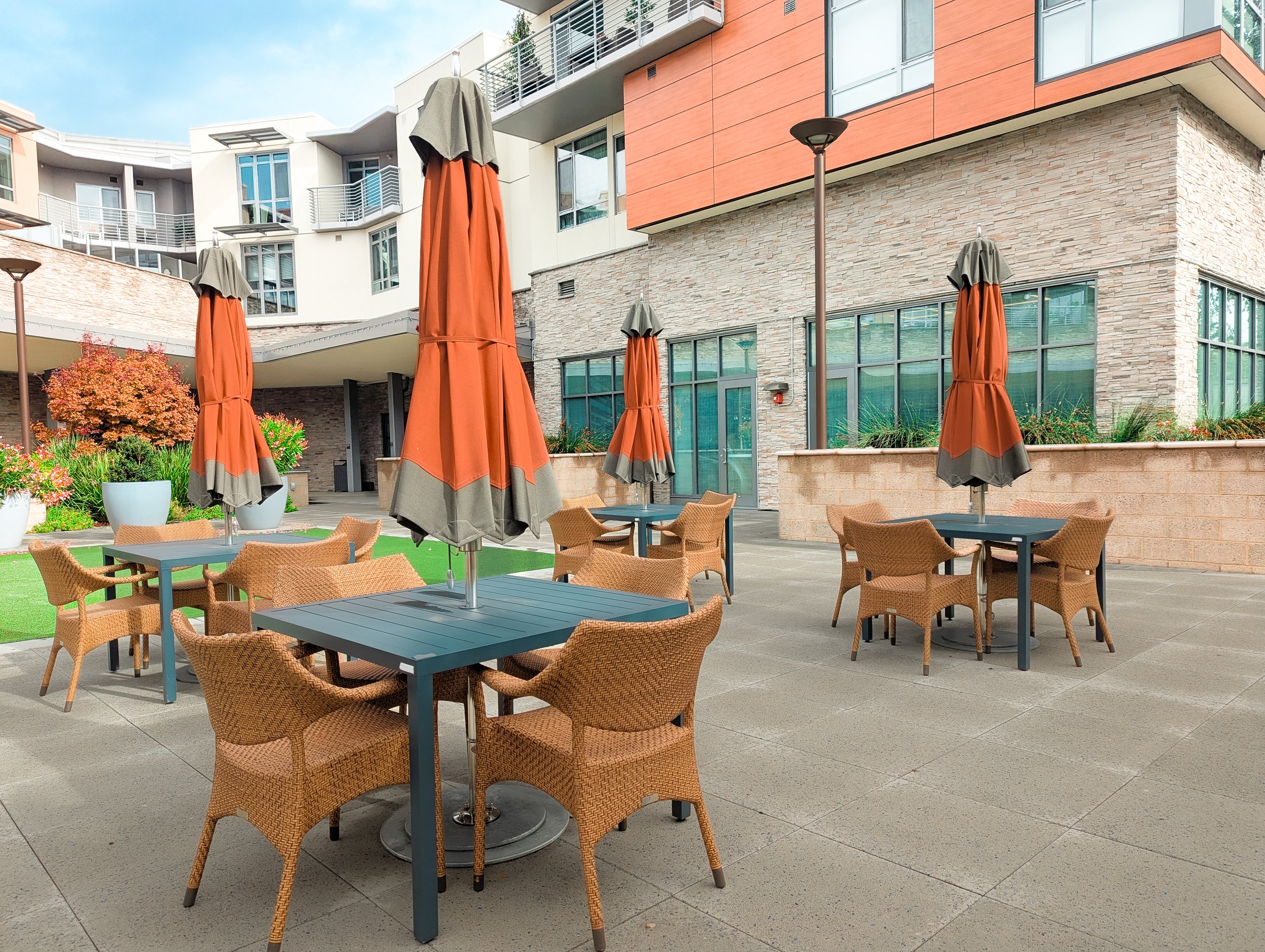 Outdoor dining and adjacent flexible lawn space provide opportunities for exercise activities and social gatherings.