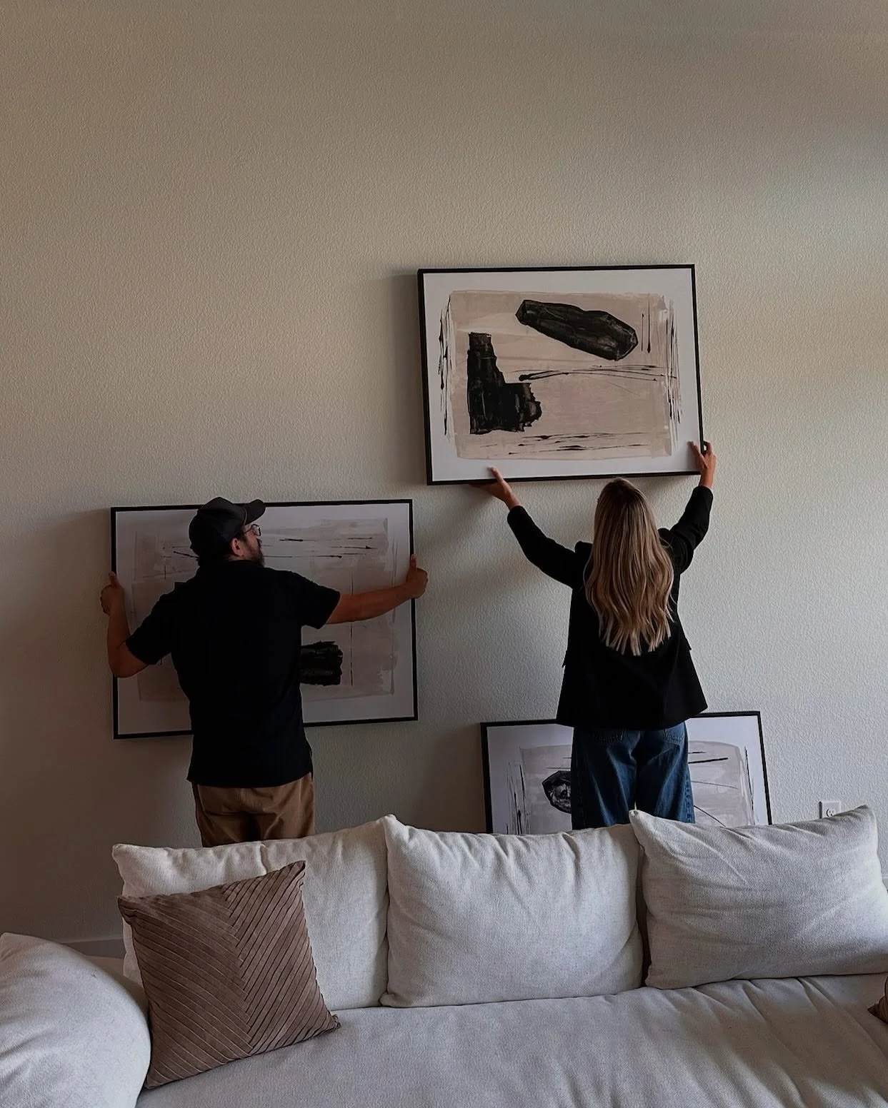 Today’s project: creating the perfect layout for our client’s artwork. Large wall spaces can be tricky, but with the right scale, balance, and placement, they become a statement feature of the home. That’s where our design eye comes